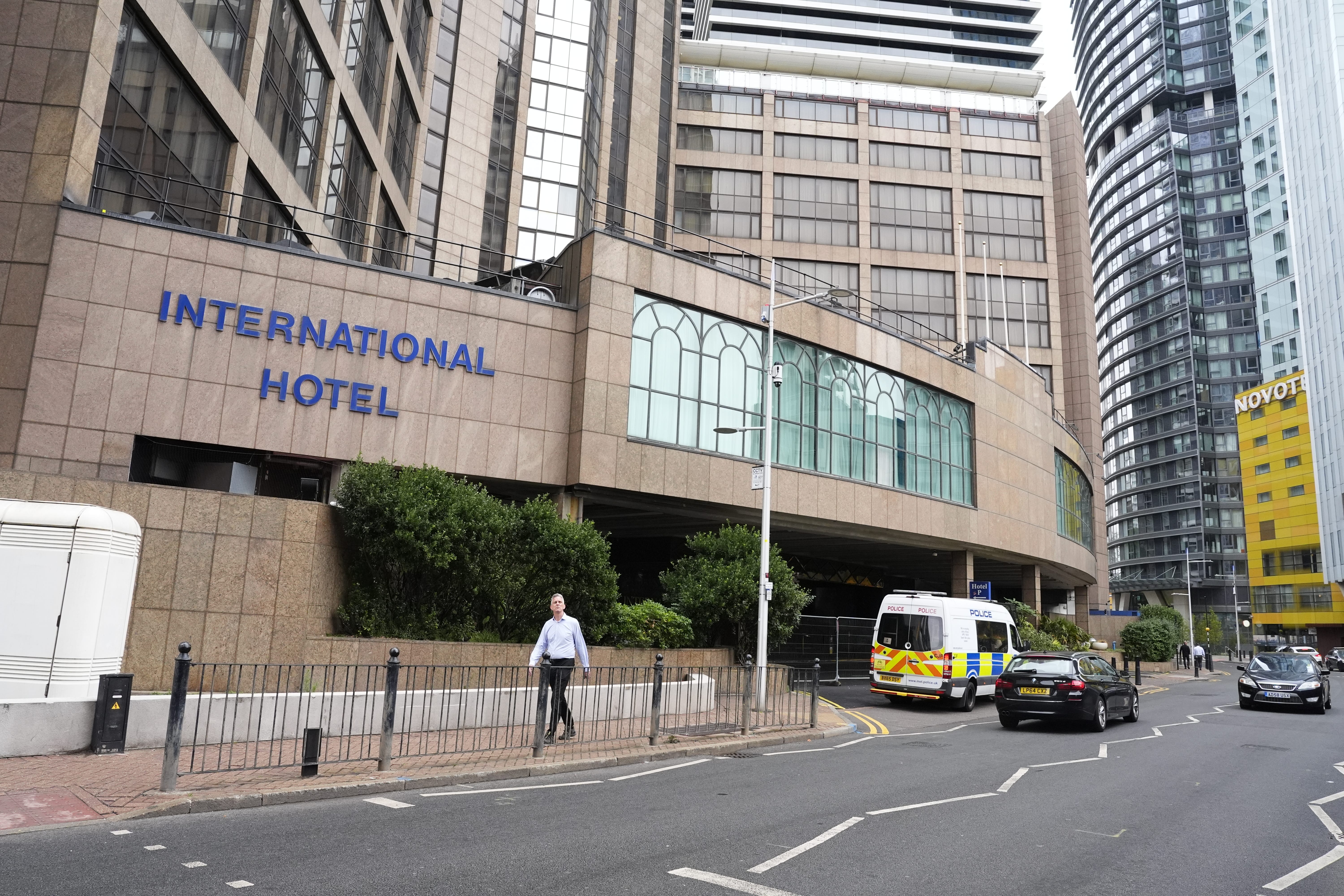 Police officers outside the Britannia International Hotel in Canary Wharf (Jordan Pettitt / PA)