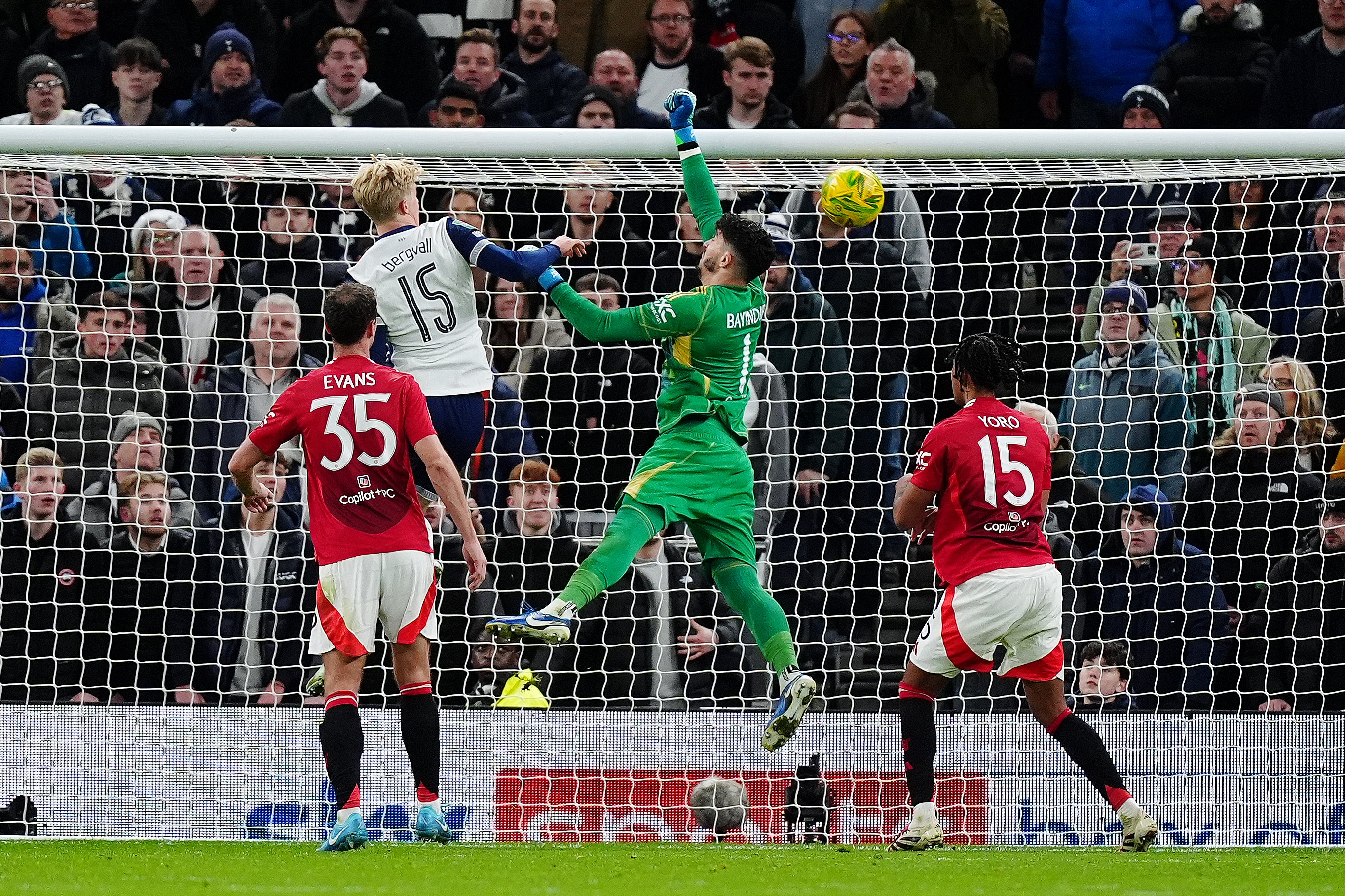 Manchester United goalkeeper Altay Bayindir (centre) fails to prevent Tottenham’s Son Heung-Min from scoring last season (Mike Egerton/PA)