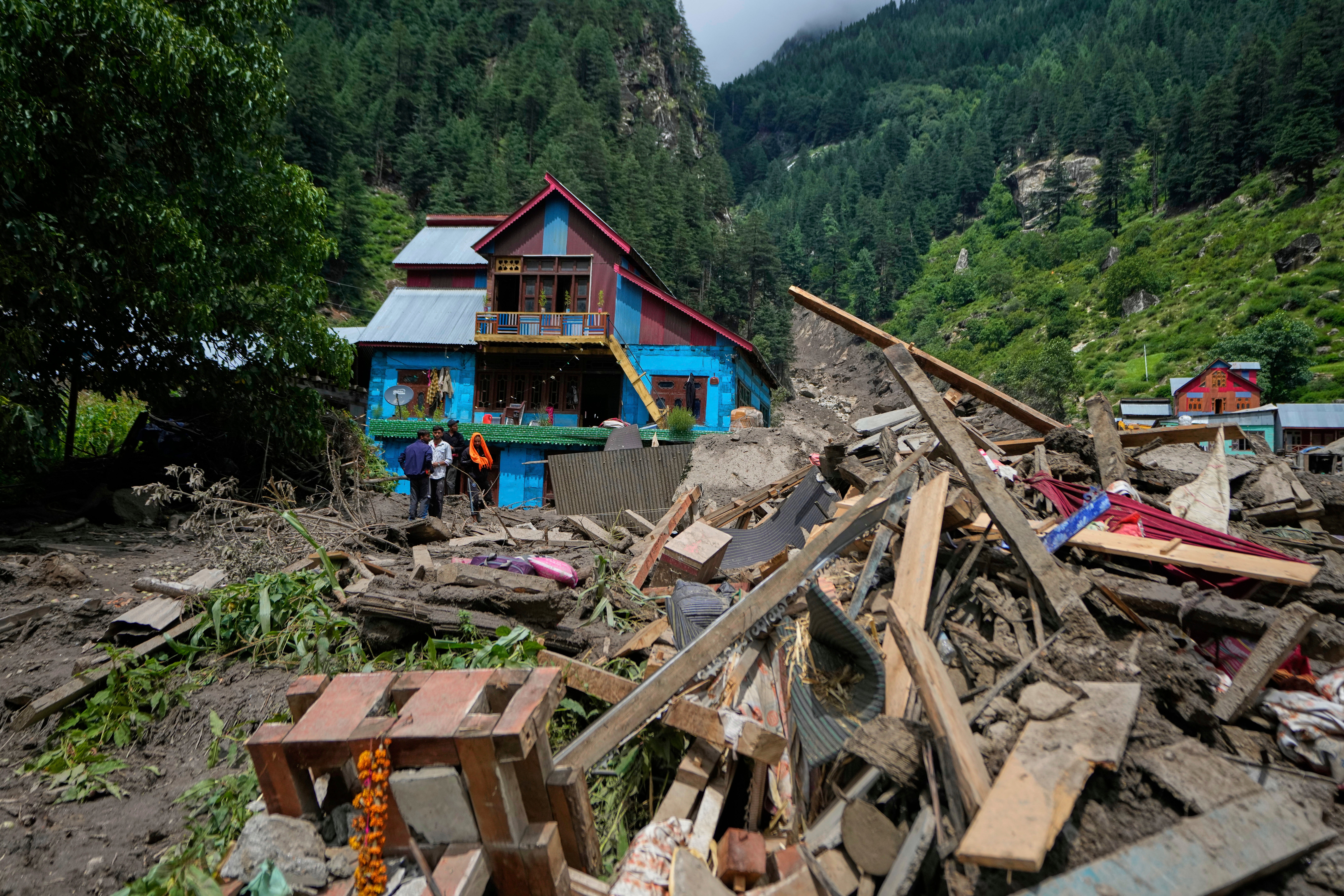 Buildings damaged by Thursday's flash floods are seen in Chositi village, Kishtwar district, Indian-controlled Kashmir, Friday, Aug. 15, 2025. (AP Photo/Channi Anand)