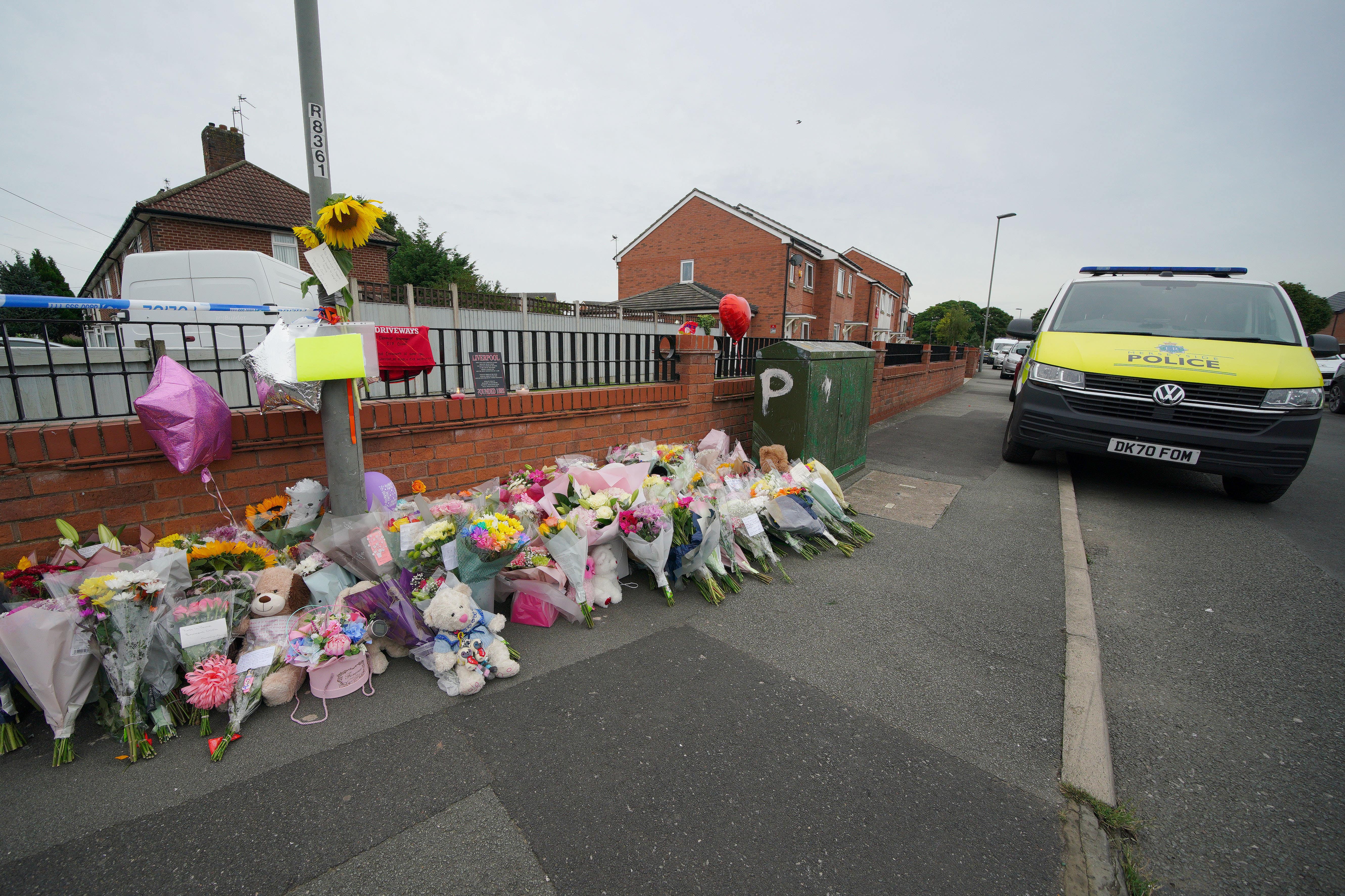 Flowers on Kingsheath Avenue, Dovecot, after the murder of Olivia Pratt-Korbel (Peter Byrne/PA)