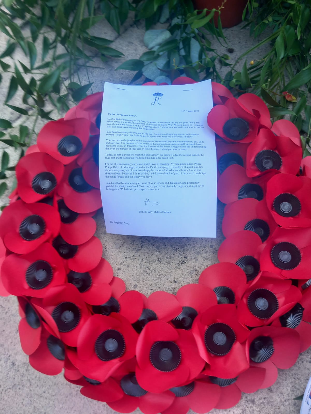 The Duke of Sussex's letter and wreath, left on his behalf at the National Memorial Arboretum in Staffordshire on VJ Day