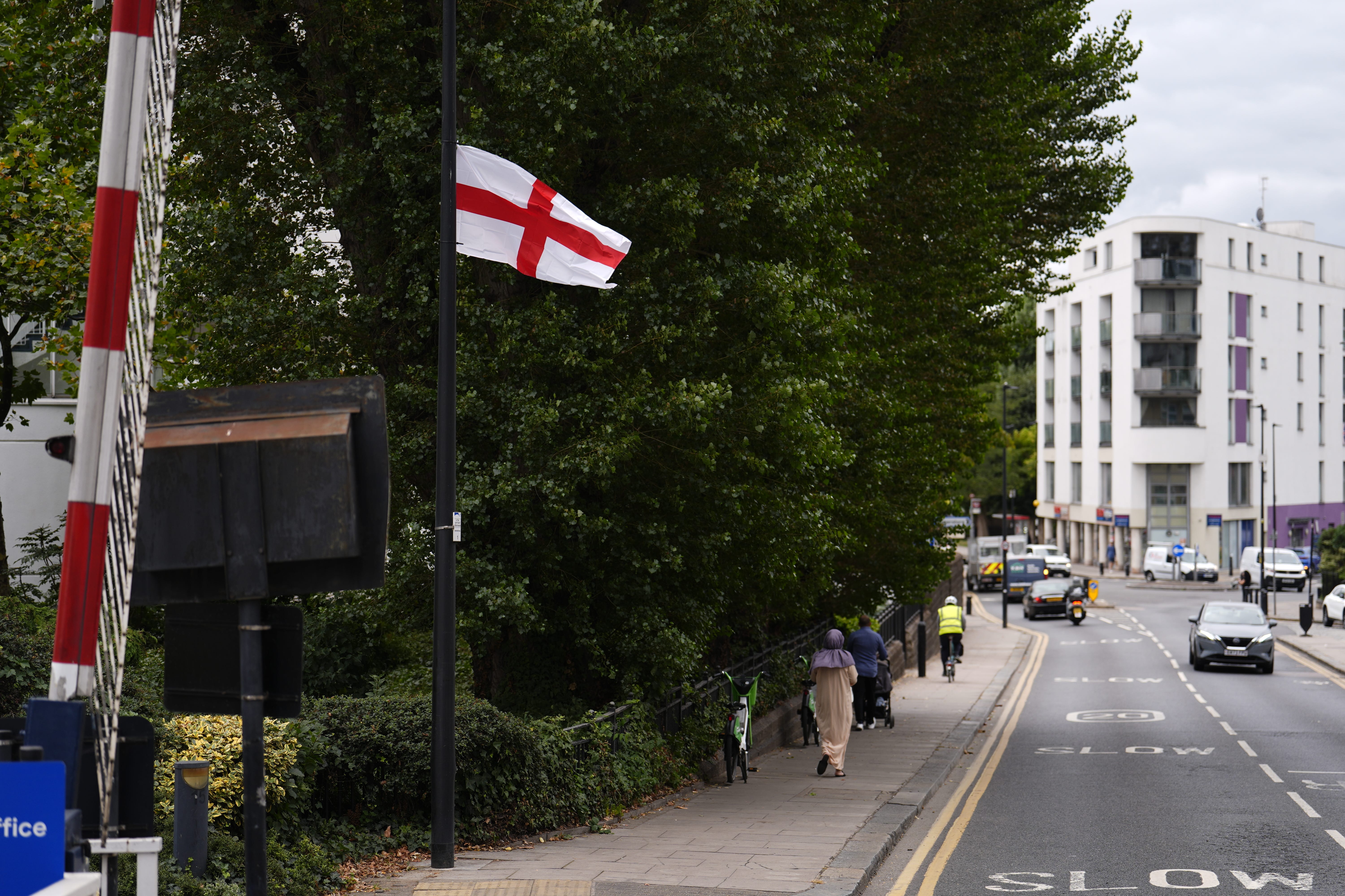 A St George’s Cross flag on the A1206 in the Isle of Dogs (Jordan Pettitt/PA)