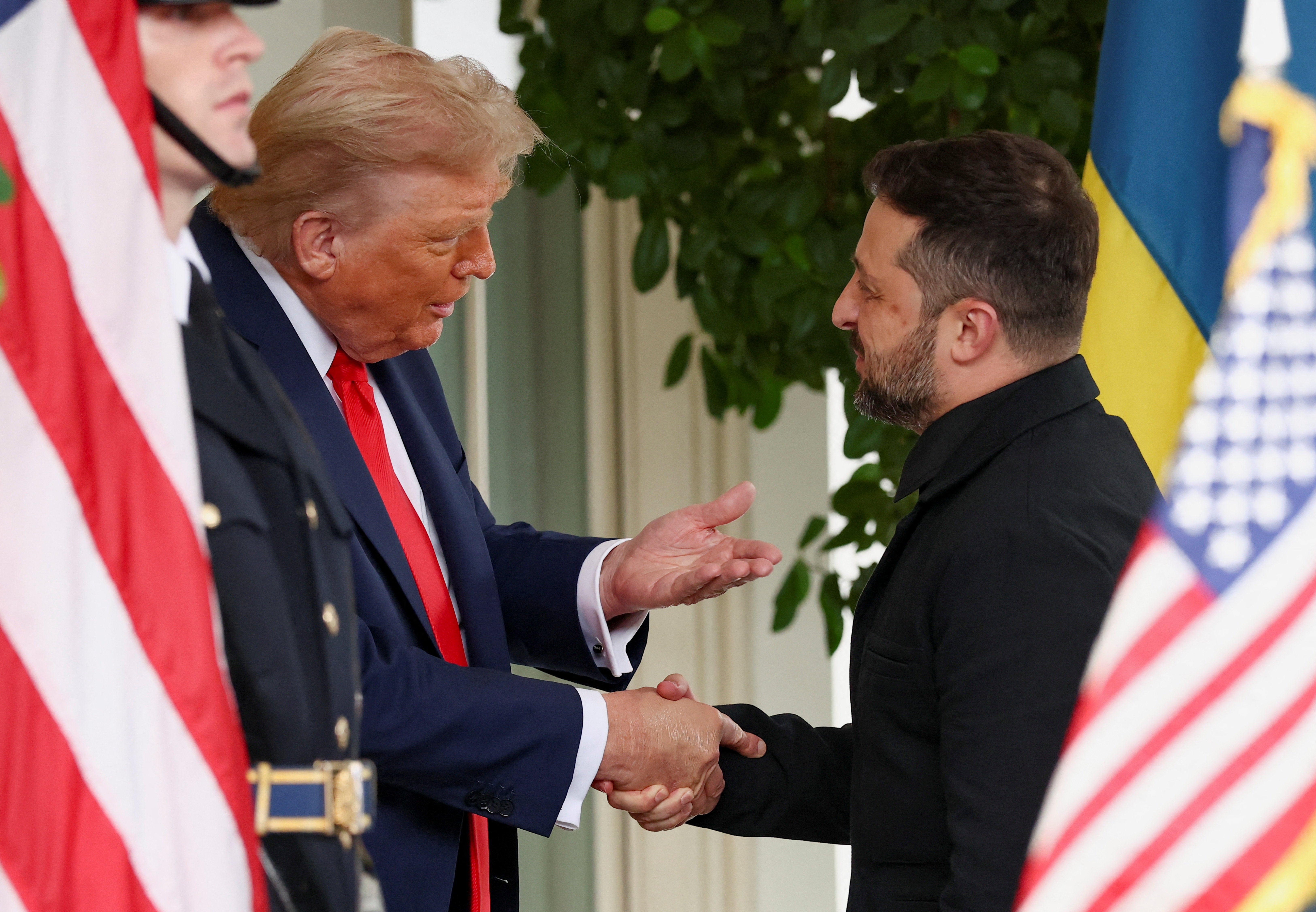 Zelensky shows up to White House in all-black suit - but no tie - after Trump complained about his previous attire