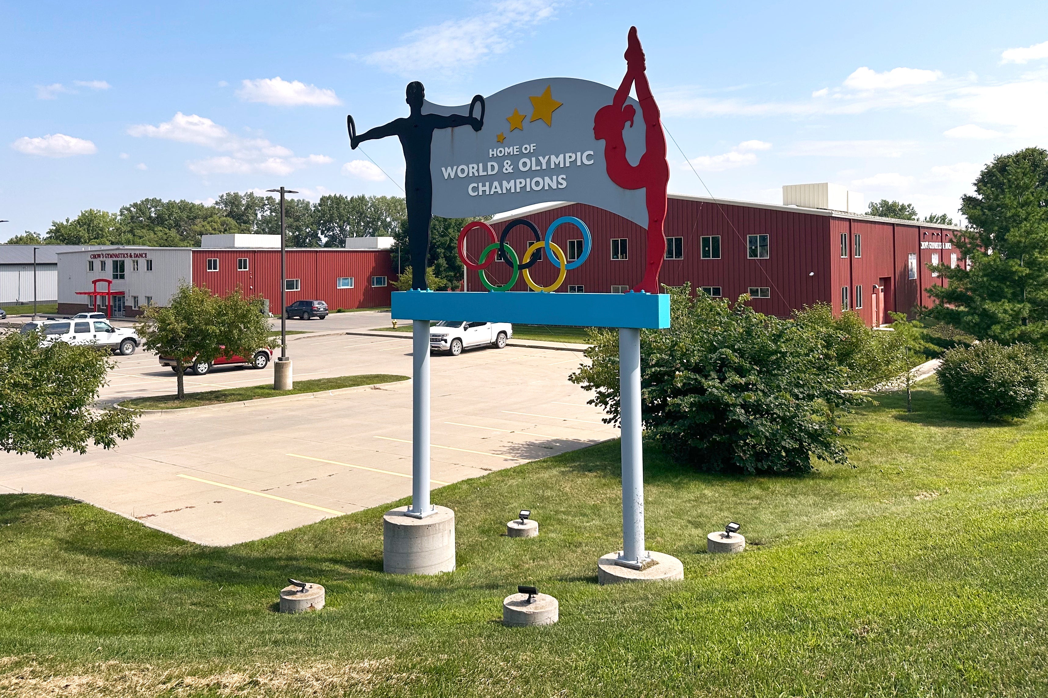 Years after abuse reports, ex-coach at renowned US gymnastics academy is arrested by FBI