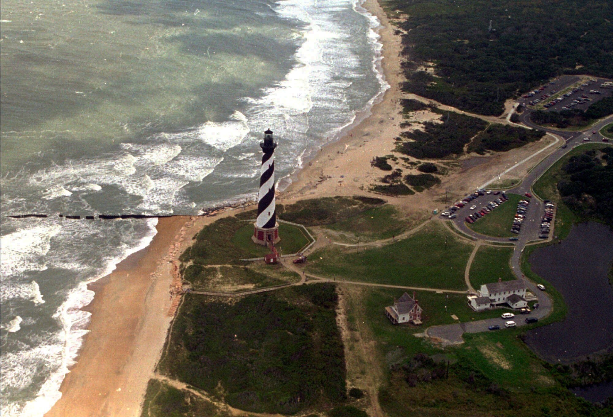 The Cape Hatteras lighthouse stands, Aug. 29, 1995 on the Outer Banks of North Carolina. (AP Photo/Ruth Fremson, File)