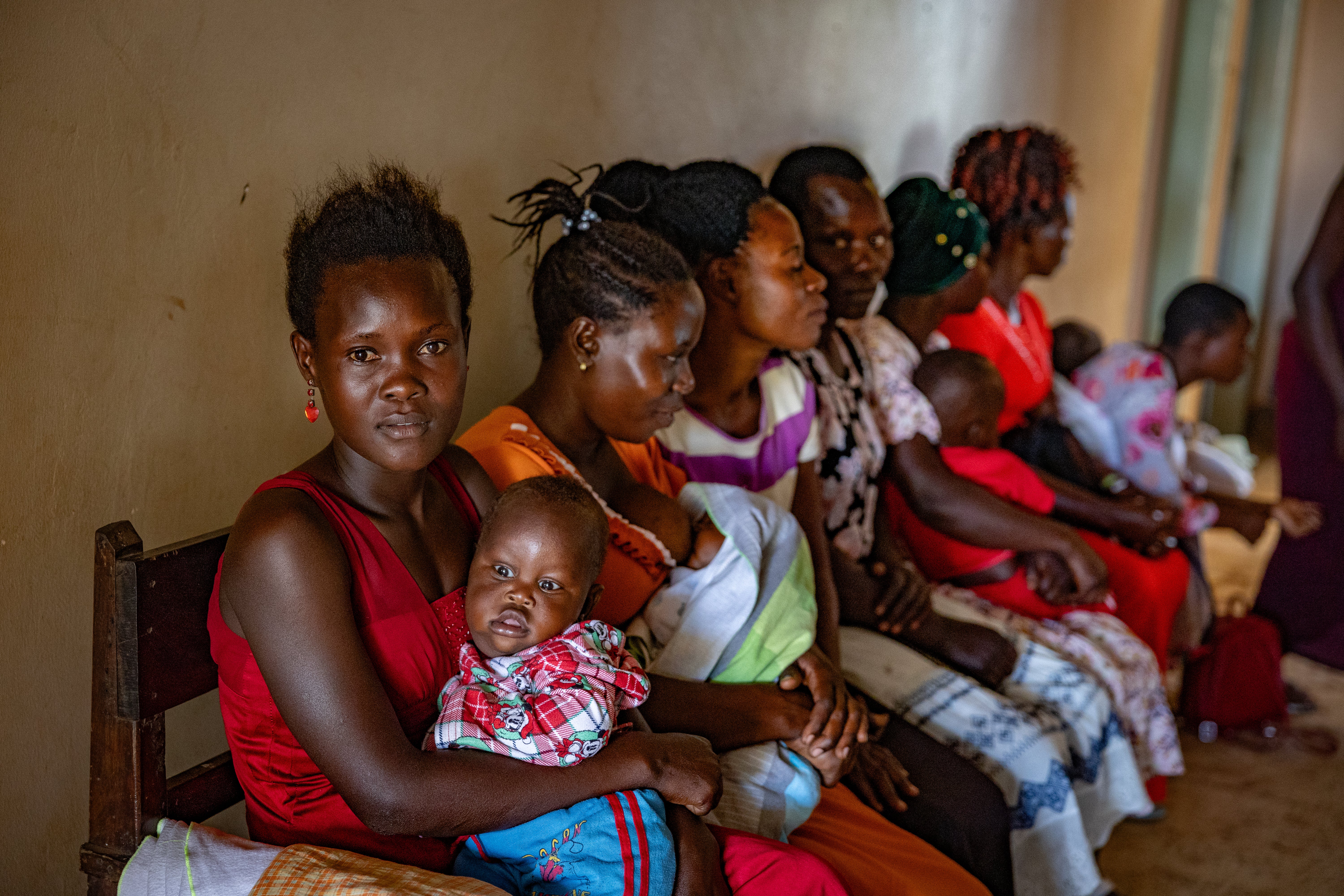 Women who have walked for hours to get to this clinic wait for contraceptive treatment in Uganda