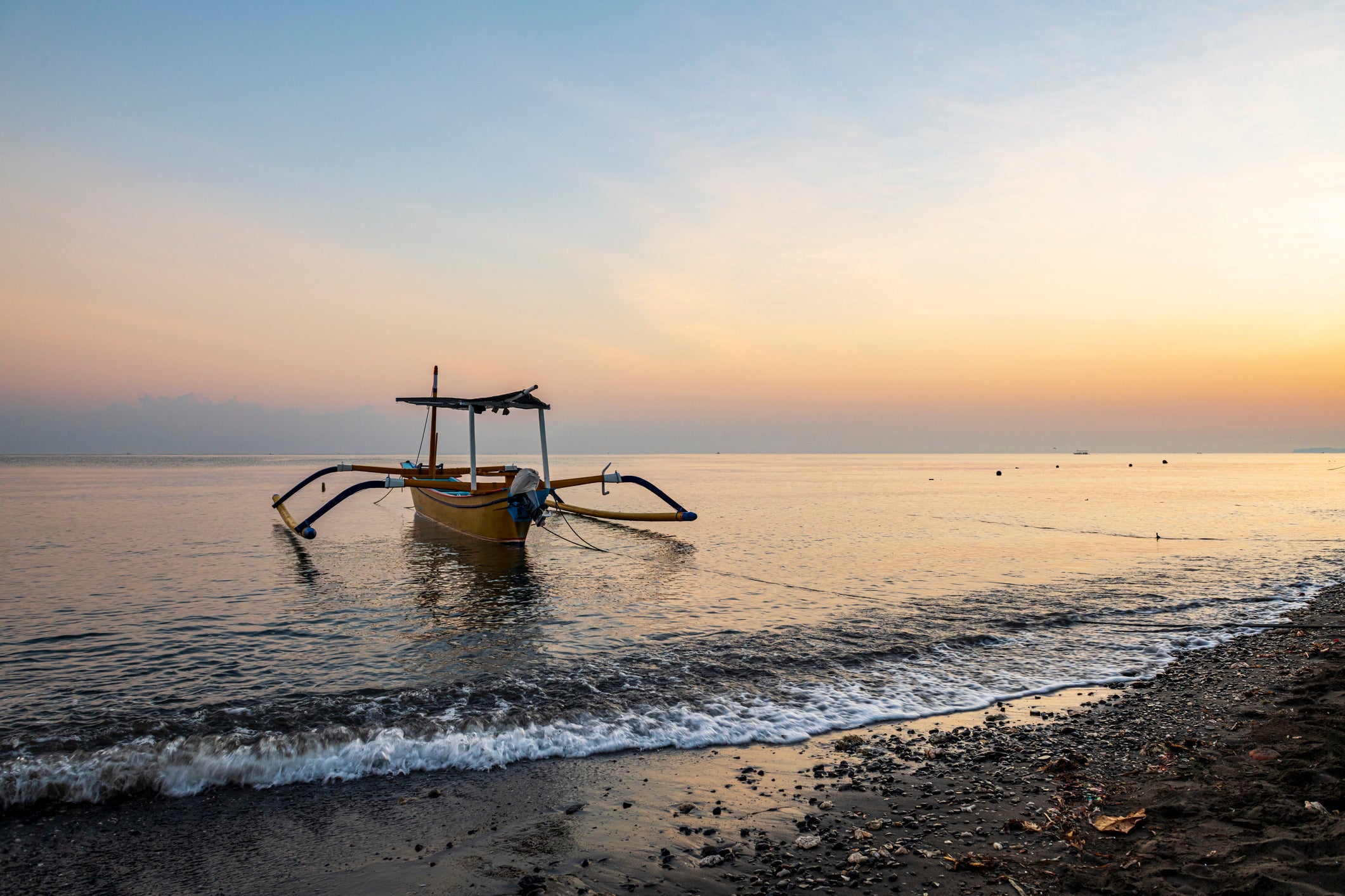 The traditional Balinese jukung boats are used to go dolphin spotting at Lovina Beach