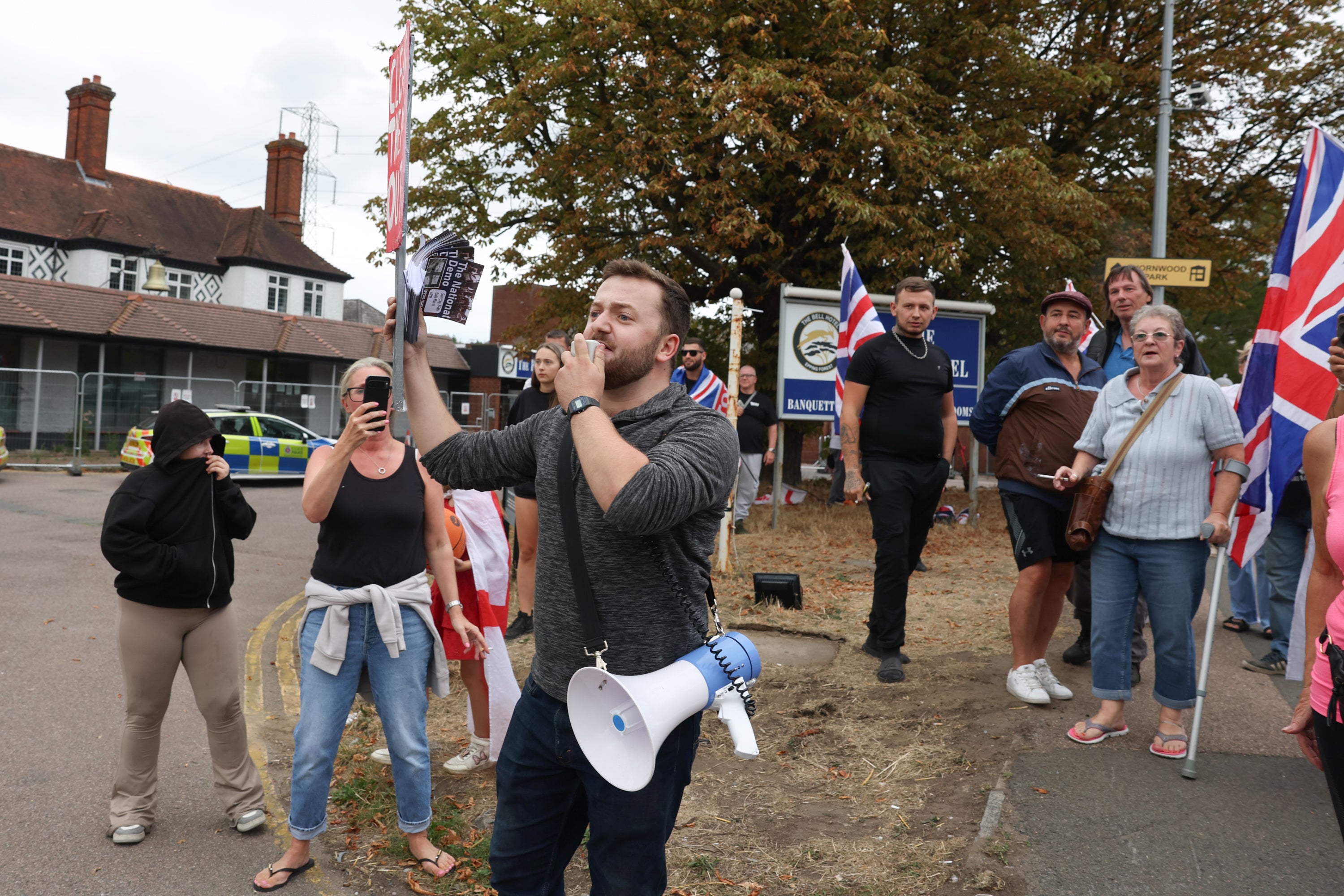 Protesters gather outside The Bell Hotel after the High Court injuction