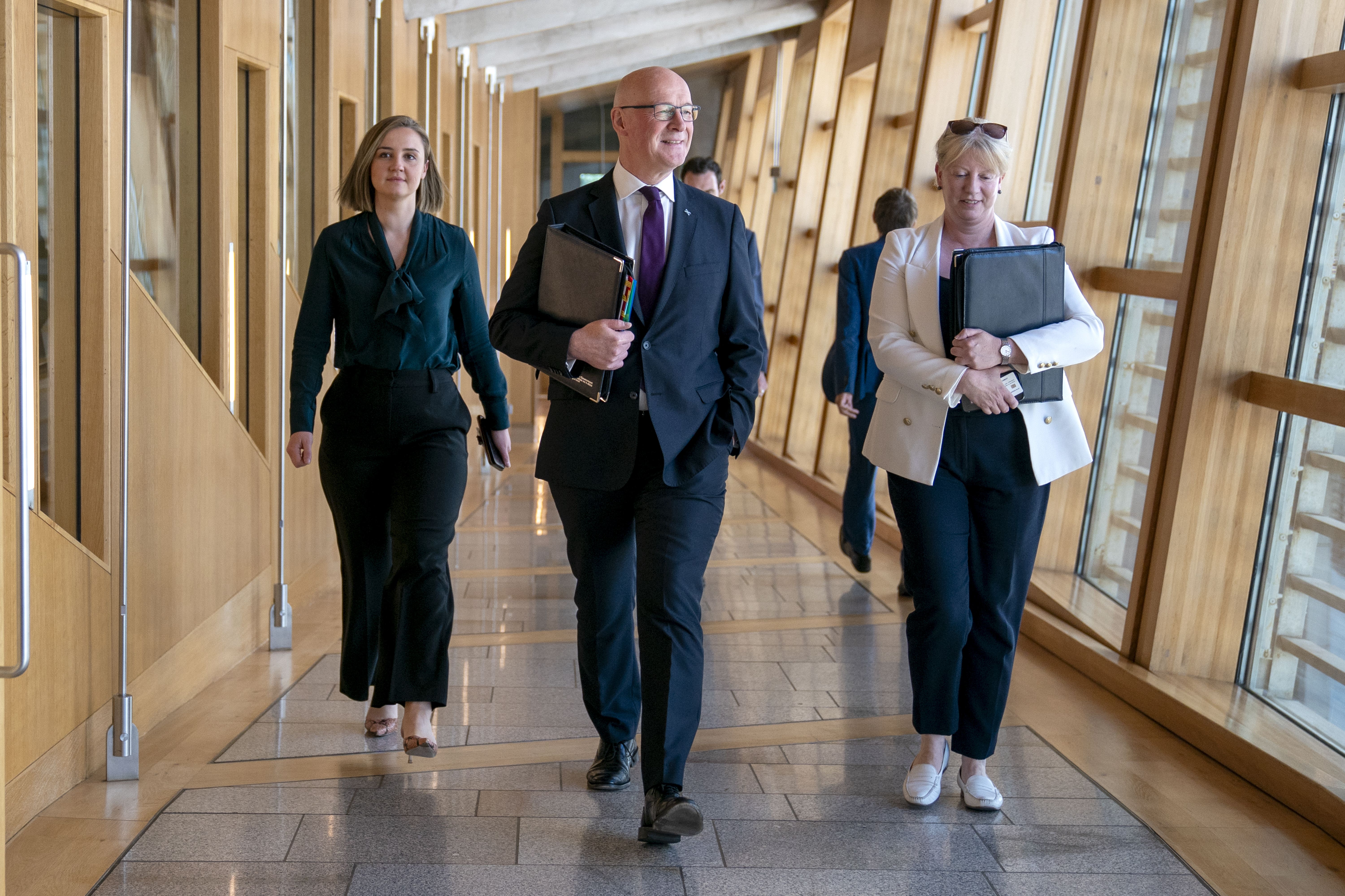 Scottish First Minister John Swinney has said he has ‘no intention’ of reshuffling his cabinet, despite a number of senior government figures saying they will stand down at the next election (Jane Barlow/PA)