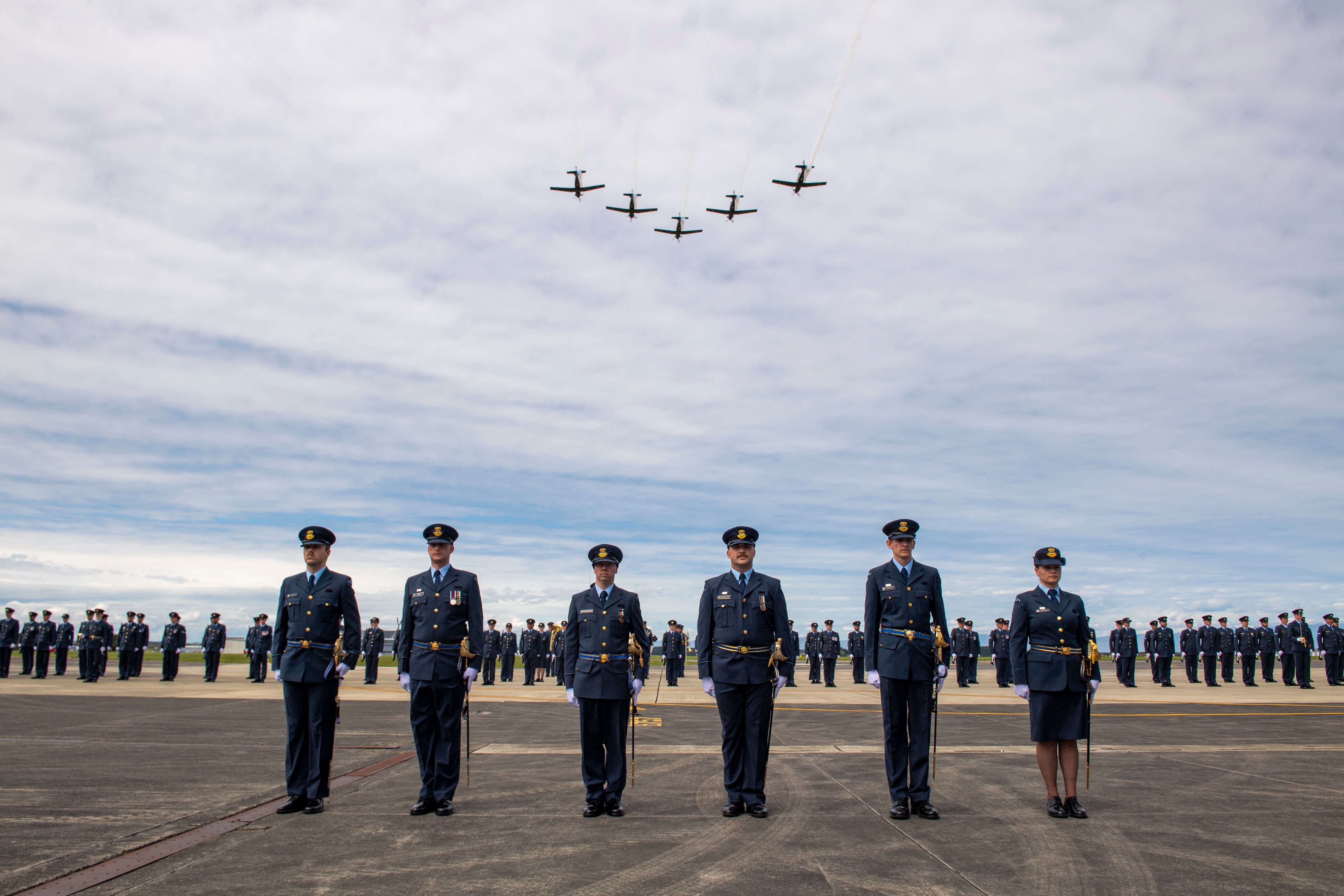 T-6C Texan aircraft flying above a graduating parade at the Royal New Zealand Air Force (RNZAF) Base Ohakea, located north-west of the city of Palmerston North in New Zealand