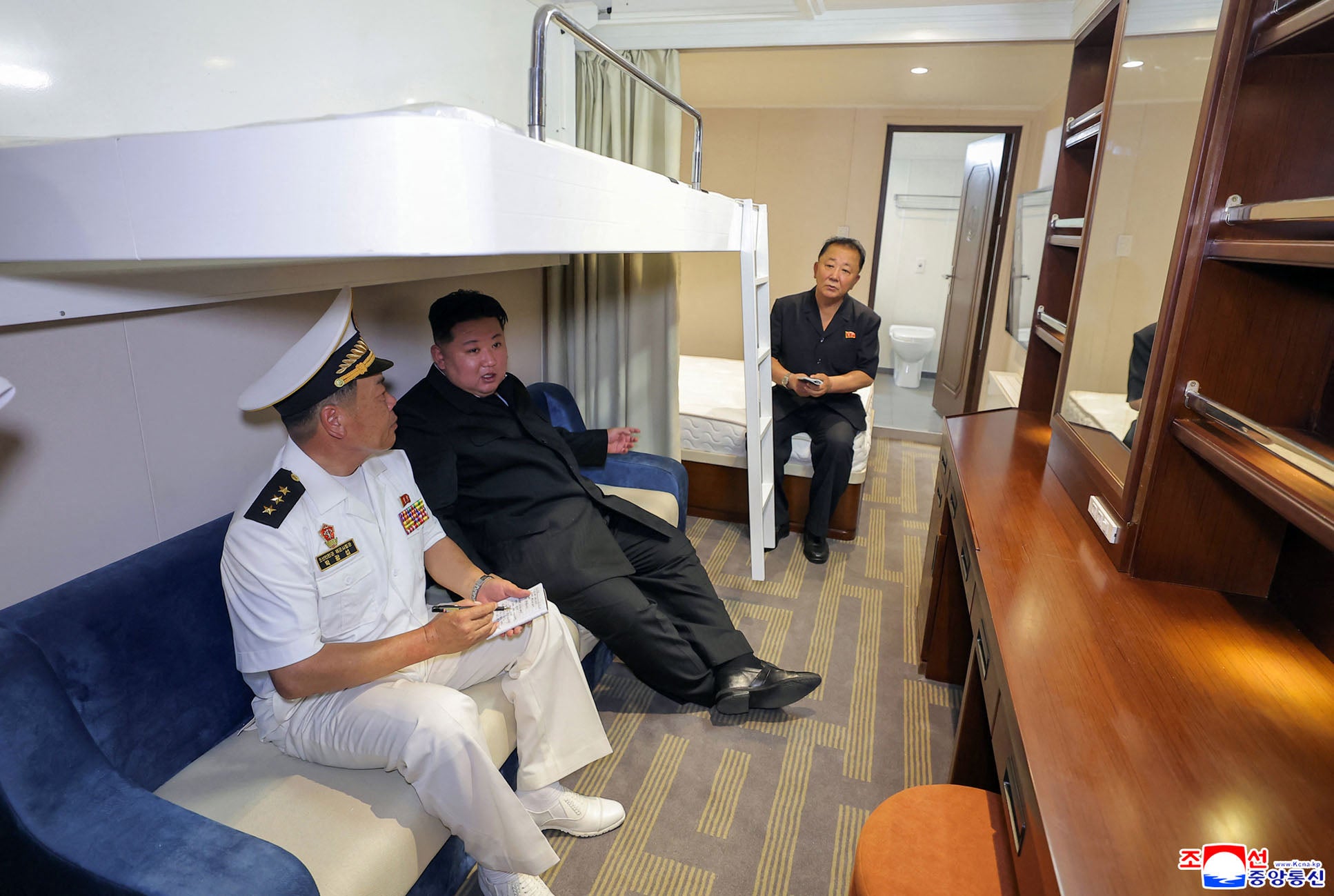North Korea's leader Kim Jong Un inspecting the interior of the naval destroyer Choe Hyon