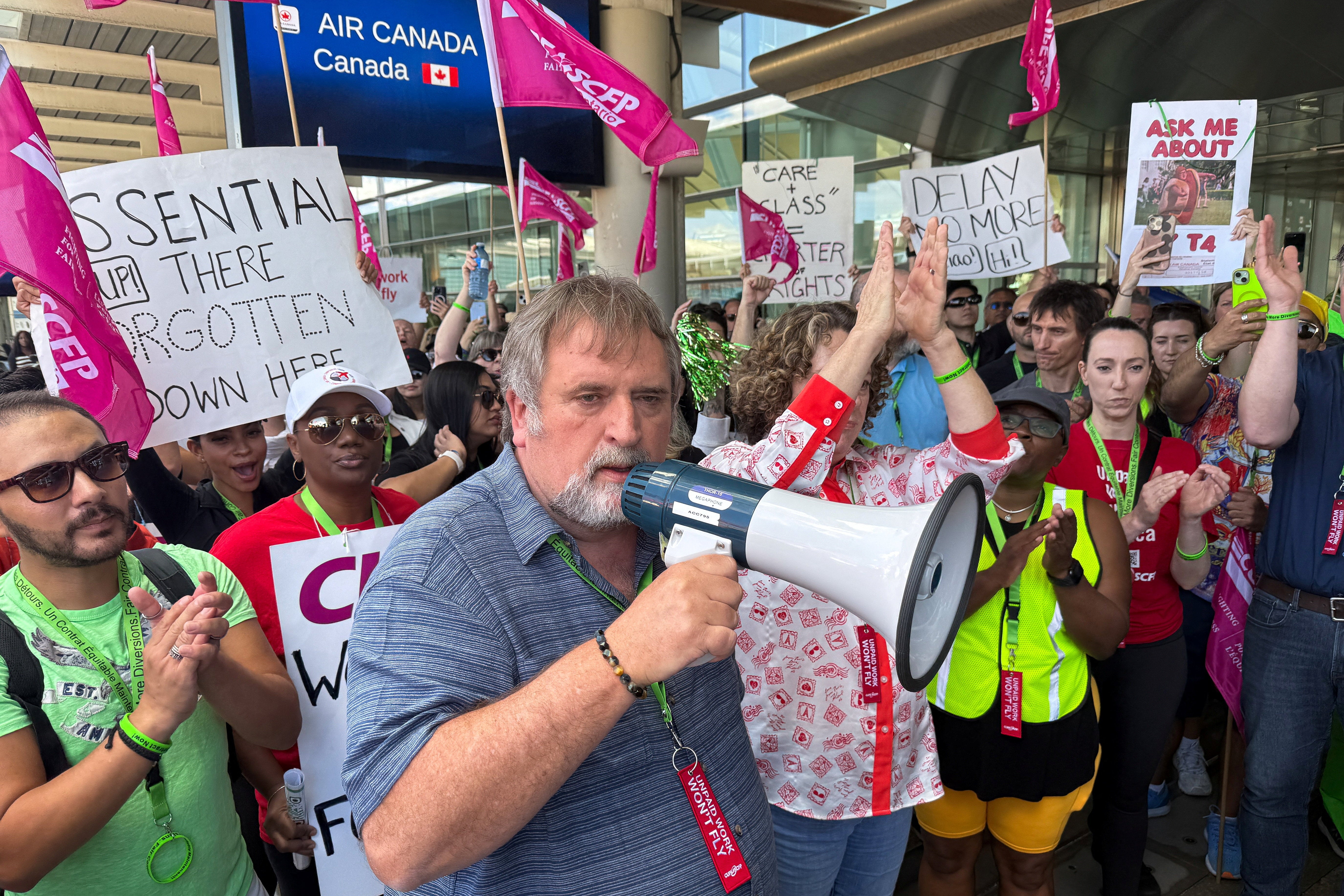 Mark Hancock, National President of the Canadian Union of Public Employees (CUPE), attends a picket line with striking Air Canada flight attendants