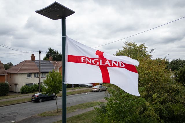 <p>A St George’s flag flies on a residential street in Birmingham</p>