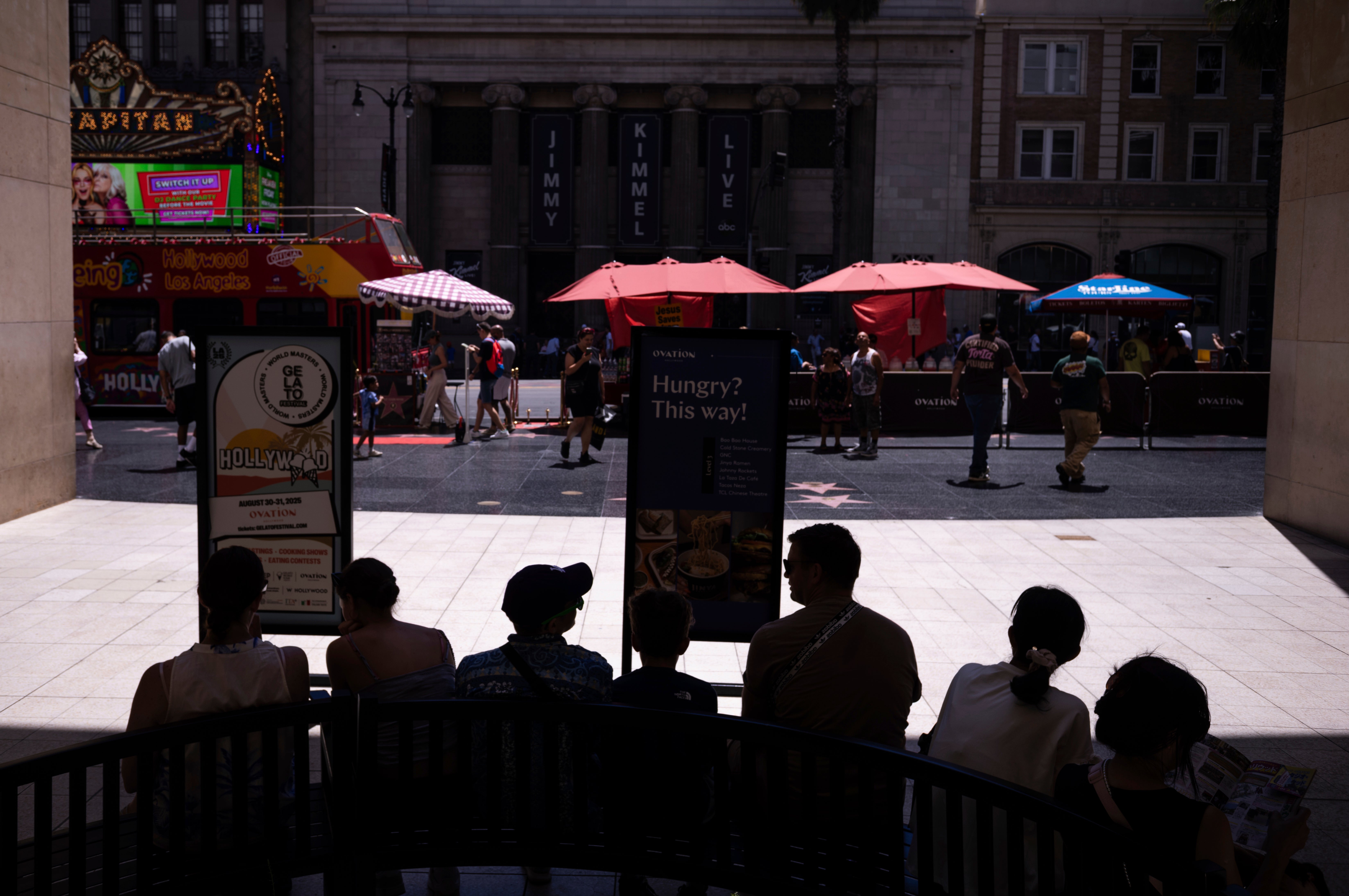 Tourists rest in the shade in Los Angeles