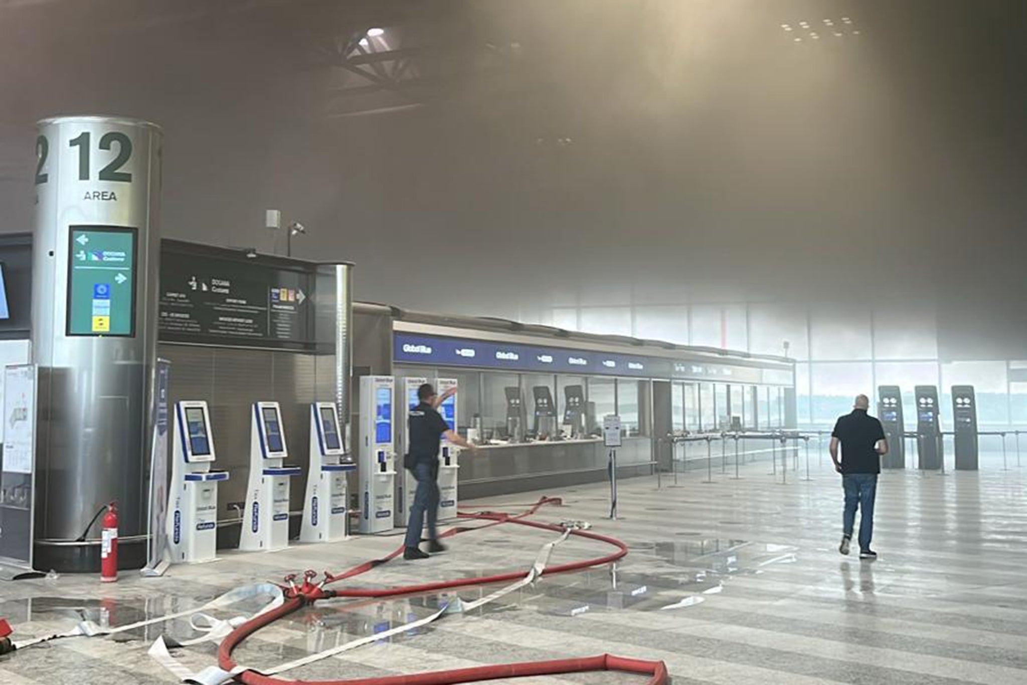 <p>After first setting fire to a waste bin, the man damaged check-in desks and information screens with a hammer, local media reported</p>