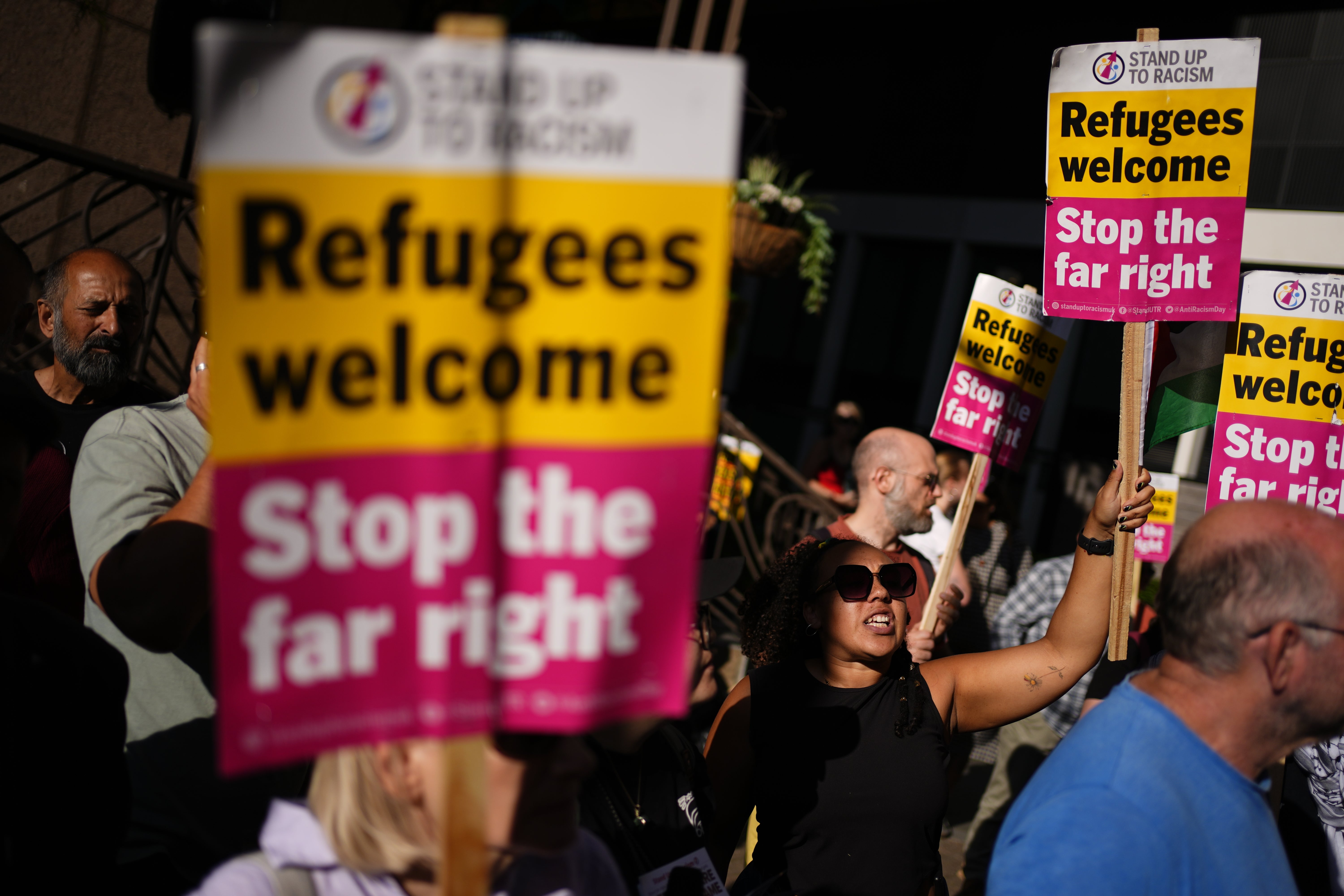 Counter-protesters have also gathered outside hotels to defend asylum seekers (Jordan Pettitt/PA)