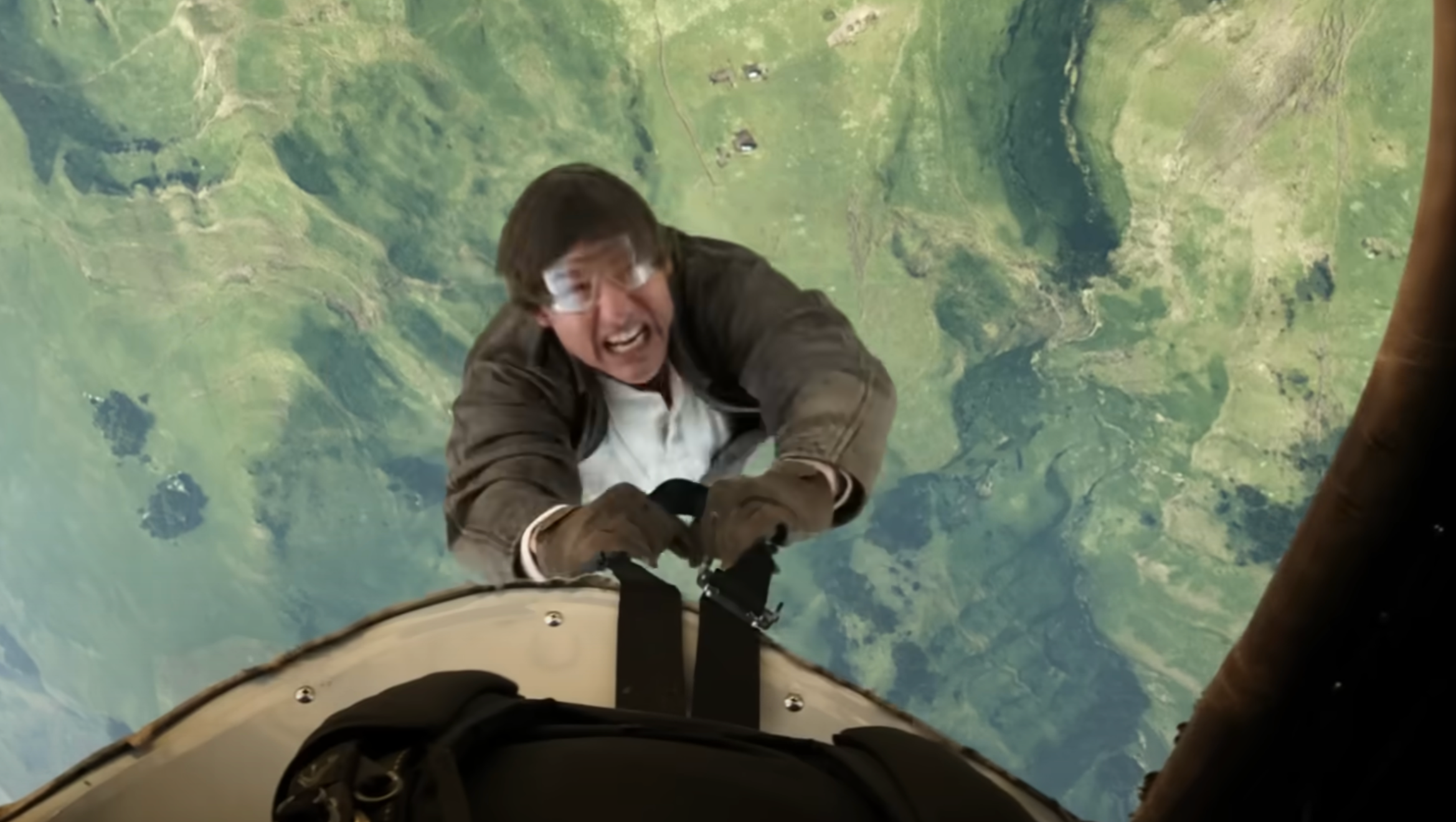 Tom Cruise clings to the seatbelt of a biplane in 'Mission: Impossible — The Final Reckoning'