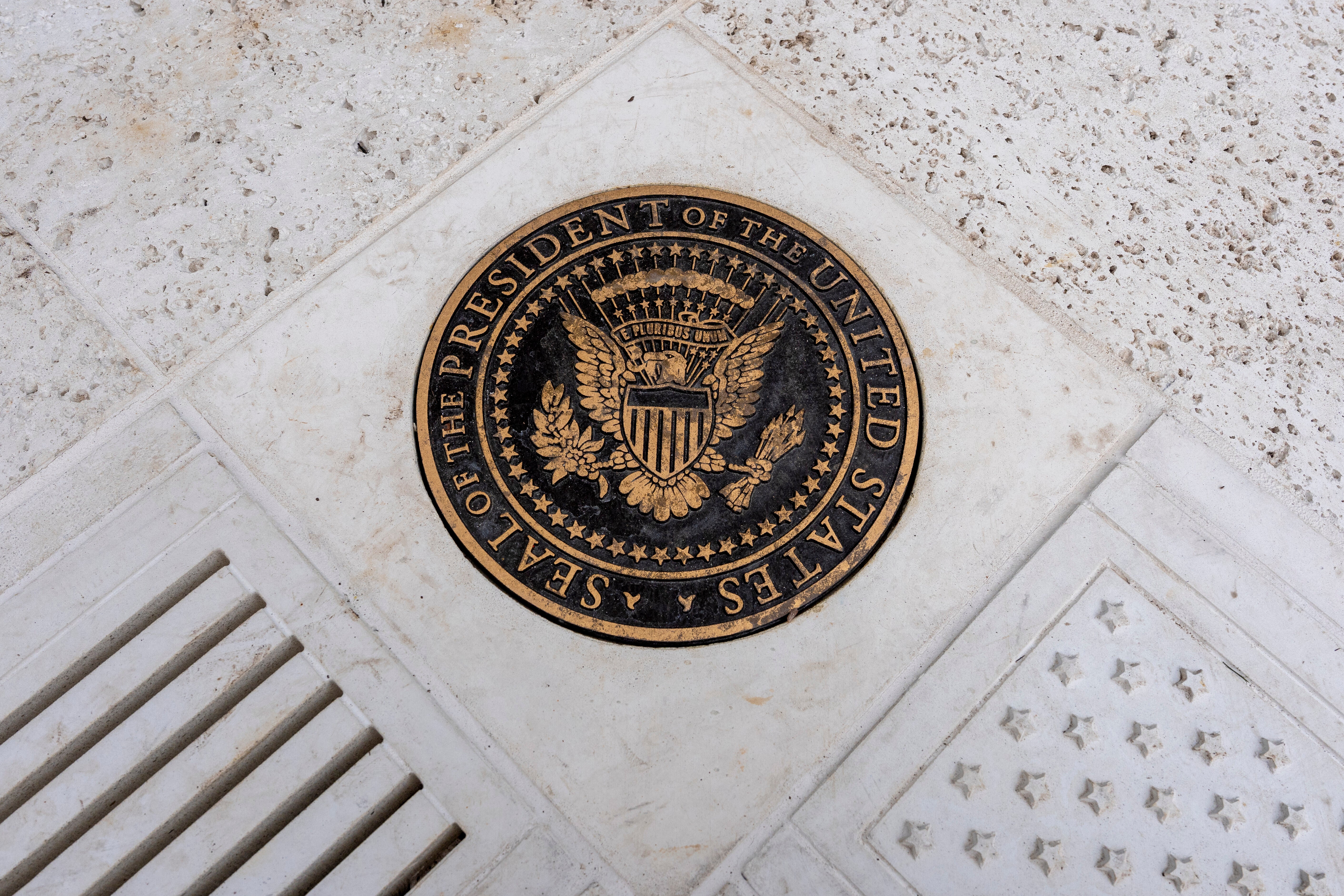 A presidential seal is on the tiles of the new patio where the Rose Garden once stood.