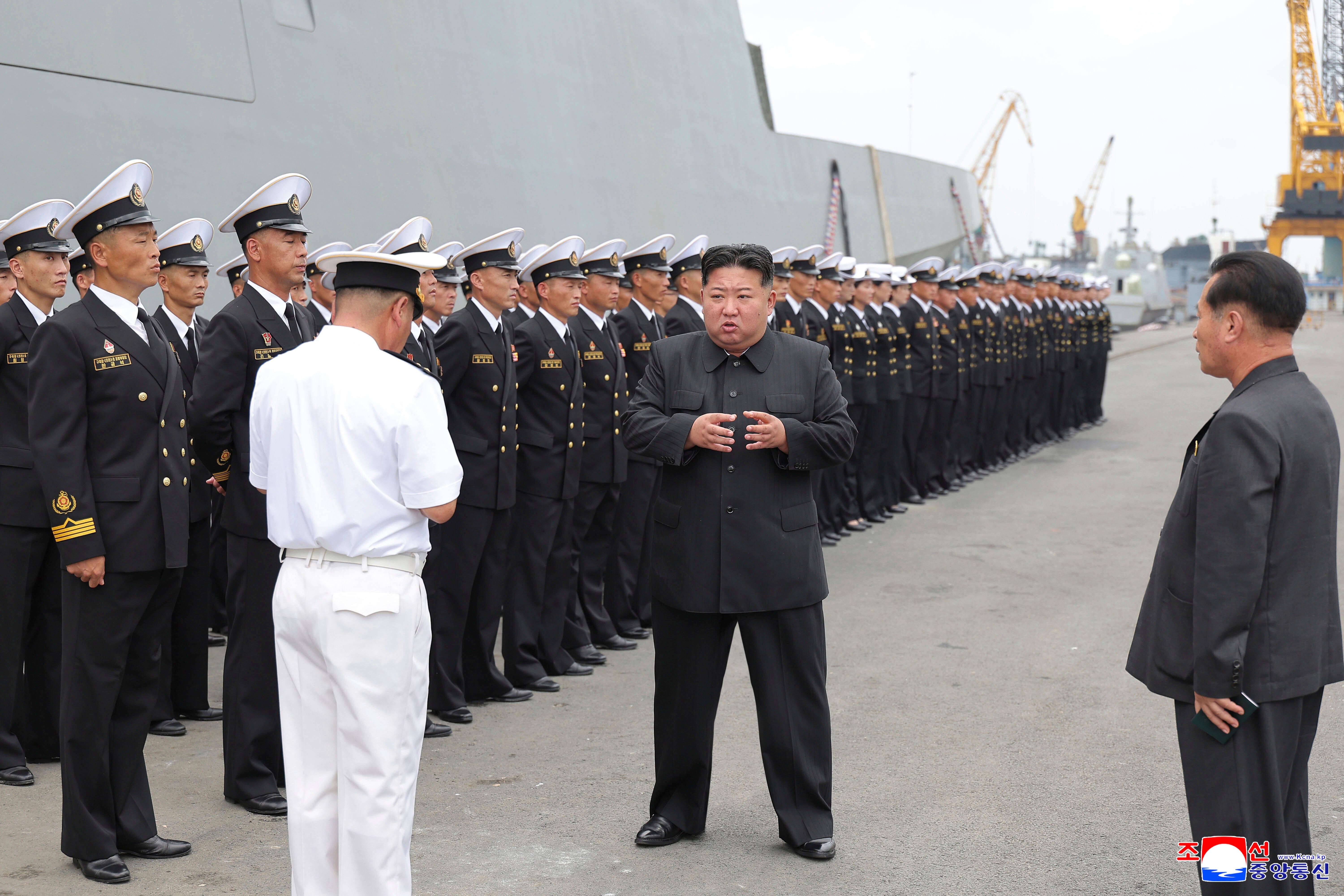 In this photo provided by the North Korean government, North Korean leader Kim Jong Un, centre, inspects the warship Choe Hyon in Nampo, North Korea, on 18 August 2025