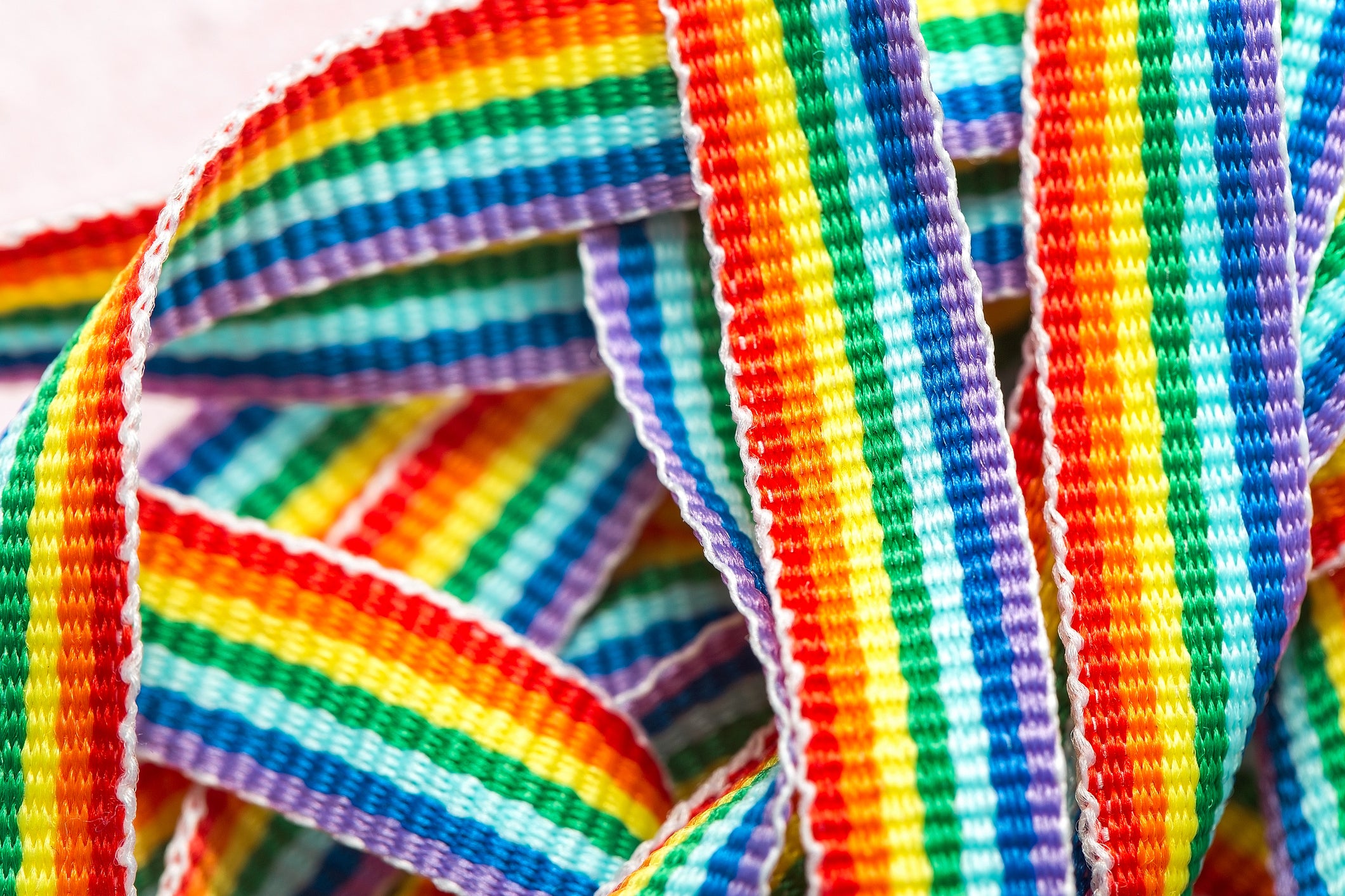 A campaign group has launched legal action seeking to prevent civil servants from wearing rainbow lanyards