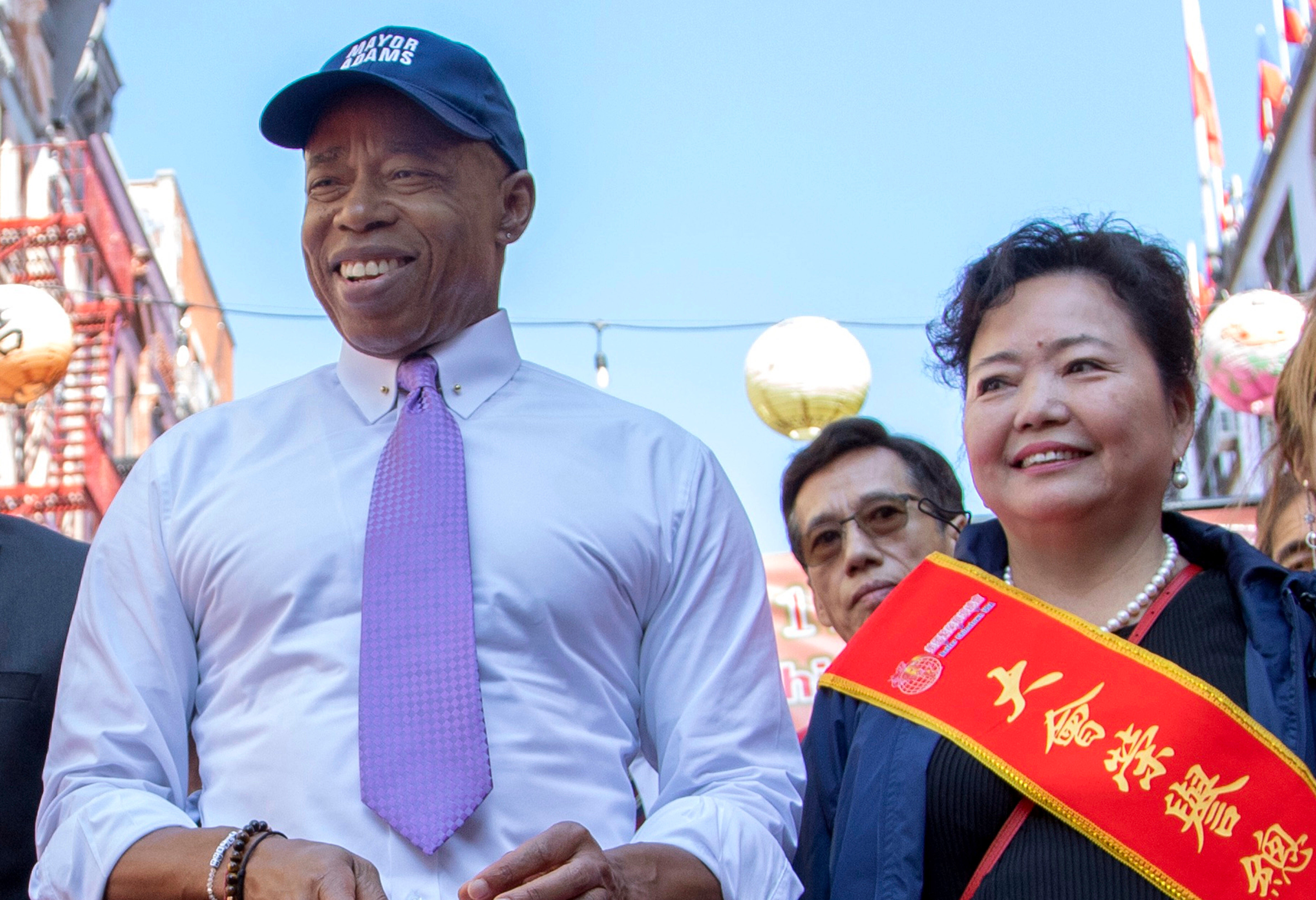 This photo provided by the New York Mayoral Photography Office shows New York Mayor Eric Adams as he delivers remarks and marches in the 21st Autumn Moon Festival and 12th China Day Festival with Winnie Greco, right, Oct. 1, 2023, in New Yor