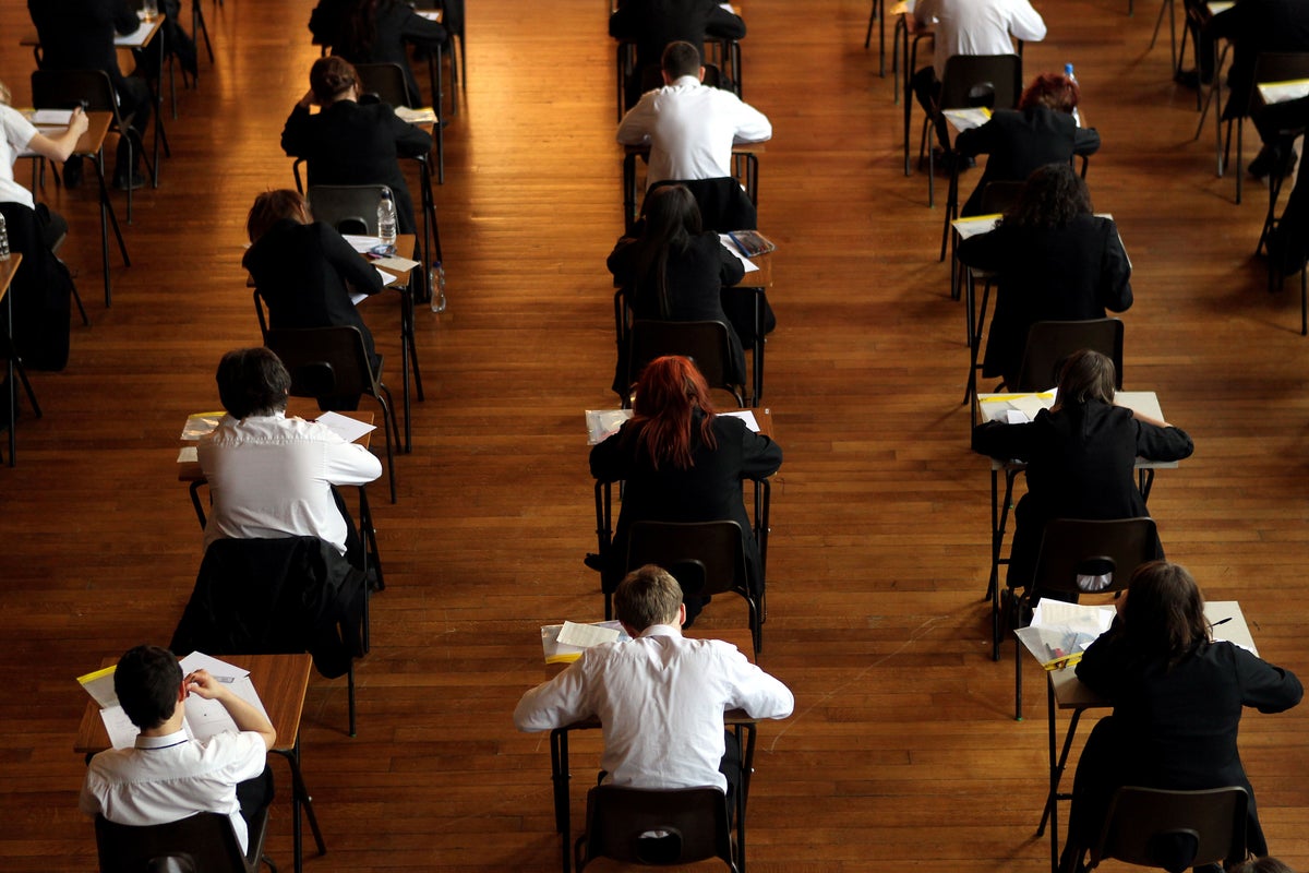 Top GCSE grades rise but key pass rate falls