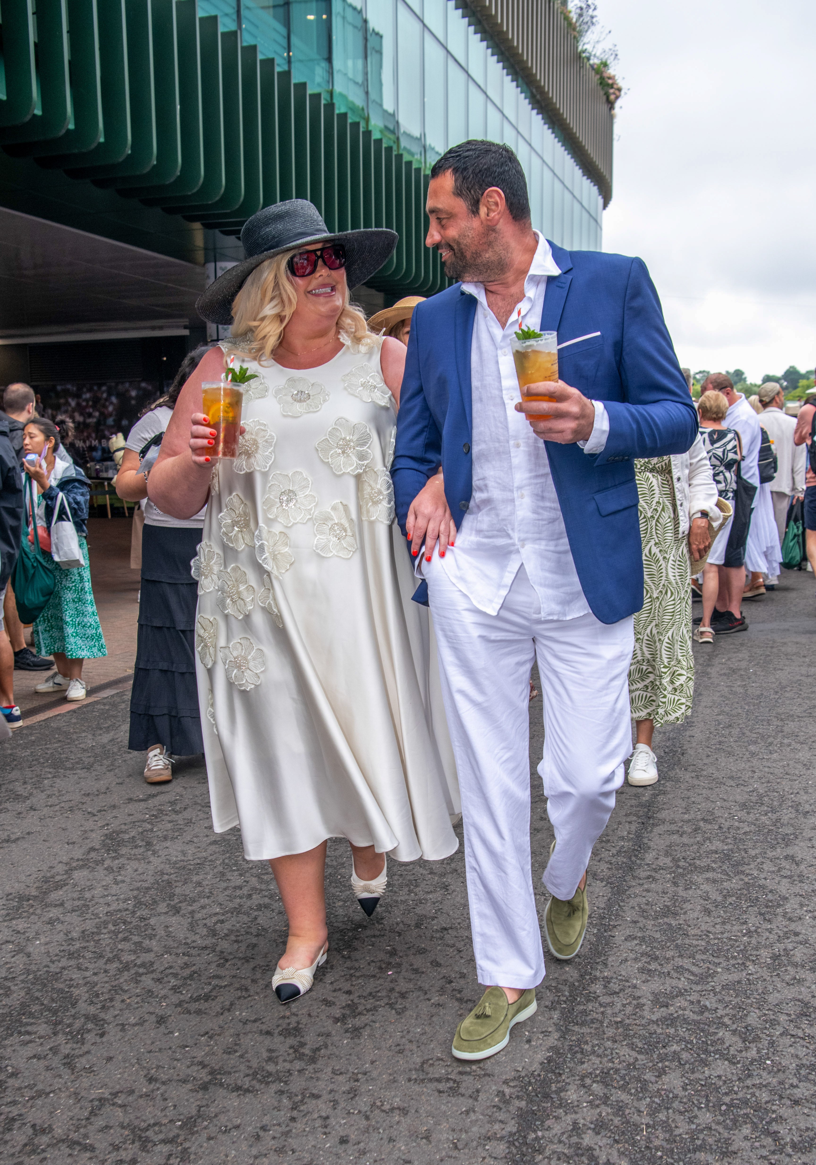 Collins and fiancé Rami Hawash at Wimbledon in July