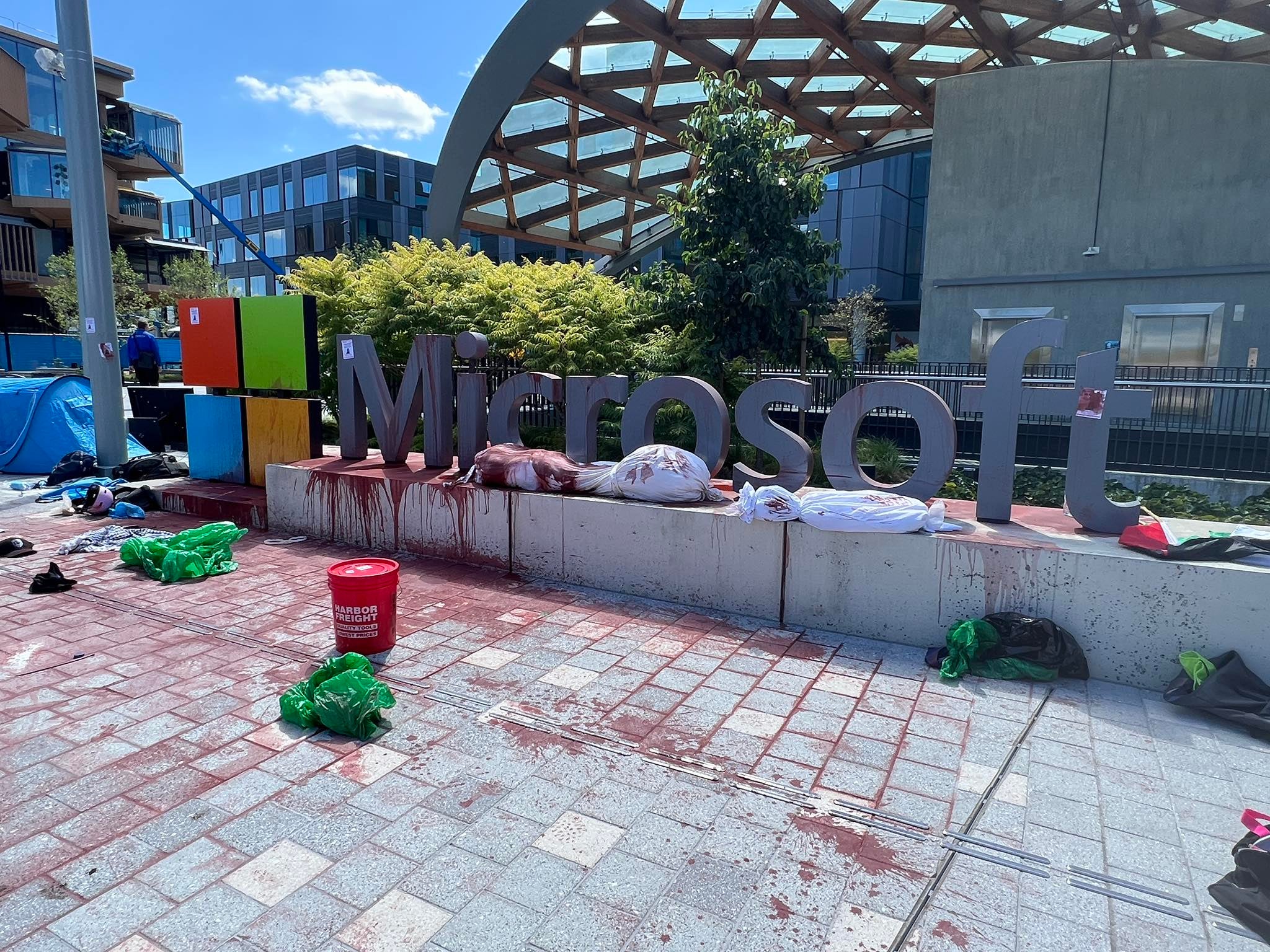The Microsoft campus in Redmond was drenched in red paint by protestors, police said