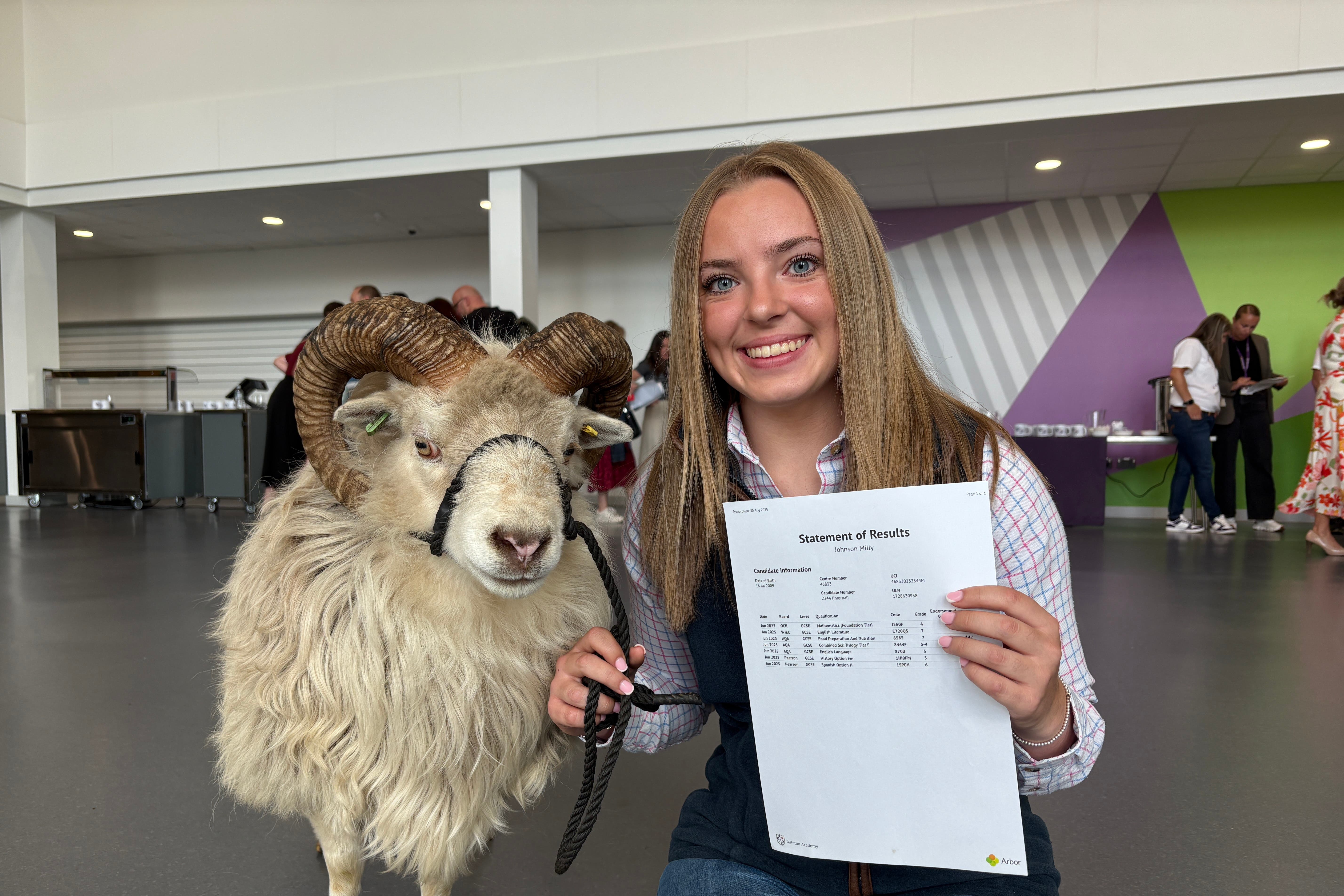 Milly Johnson, 16, collected her results with her sheep Kevin (Eleanor Barlow/PA)
