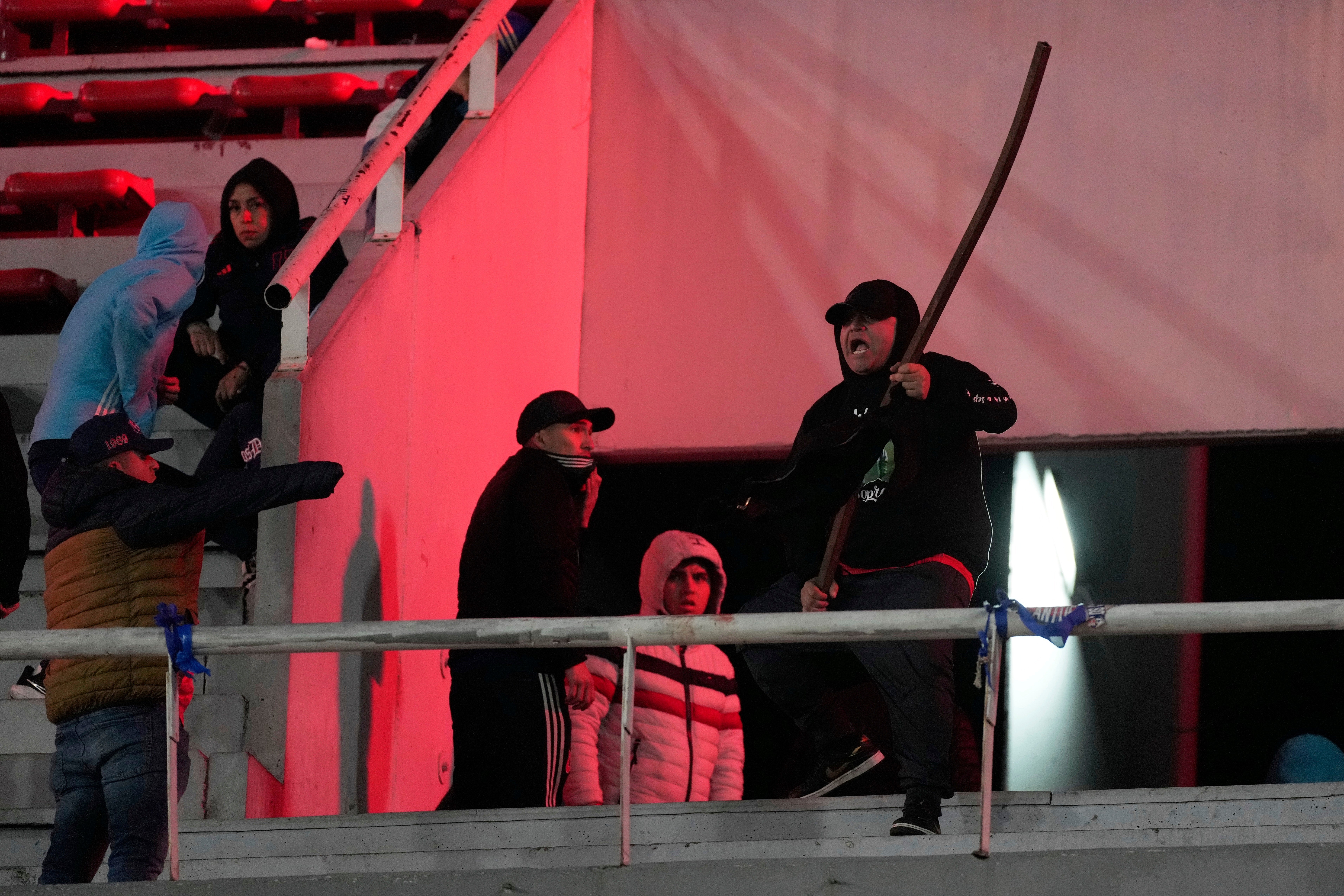 The violence forced the match's suspension and the stadium was evacuated