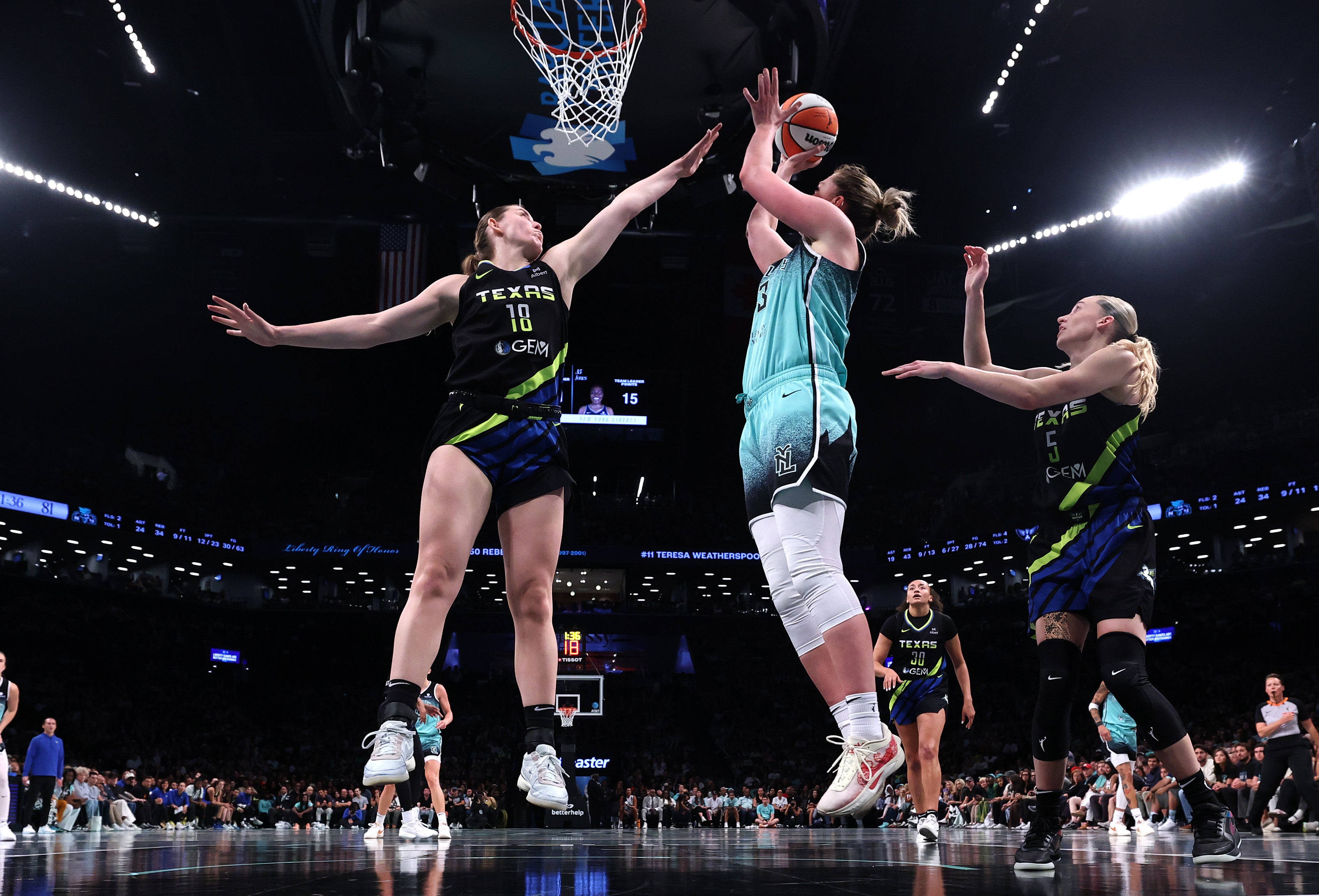 Leonie Fiebich of the New York Liberty shoots against Luisa Geiselsoder and Paige Bueckers of the Dallas Wings during the second half at Barclays Center on August 5, 2025. Charles Burgess, 32, allegedly threw a sex toy during the game that hit a 12-year-old girl. He was later arrested and charged with assault.