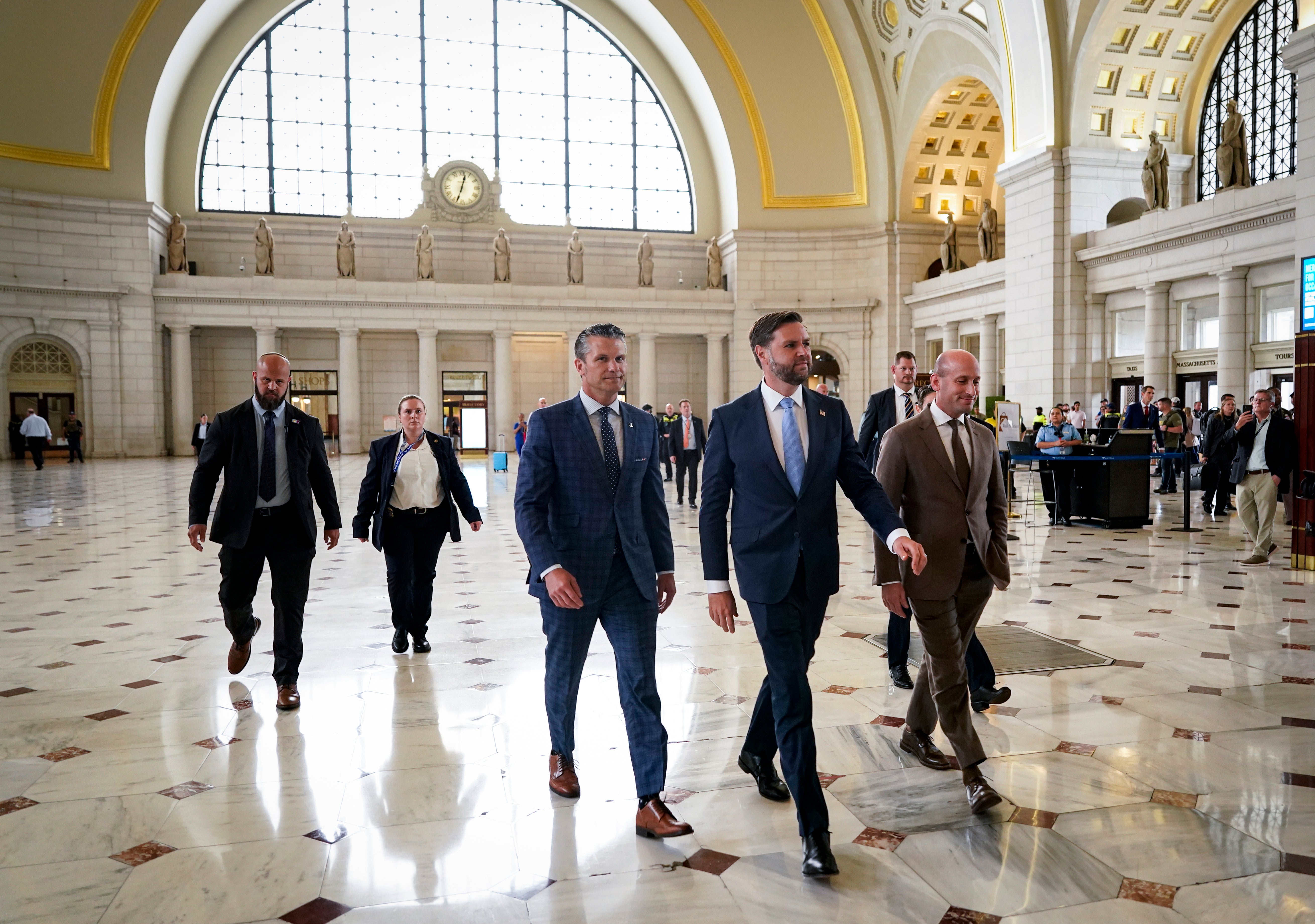 Defense Secretary Pete Hegseth, Vice President JD Vance, and White House Deputy Chief of Staff Stephen Miller arrive to meet with members of the National Guard during a visit to Union Station. A reporter's wallet was stolen at the event intended to highlight a crackdown on crime.
