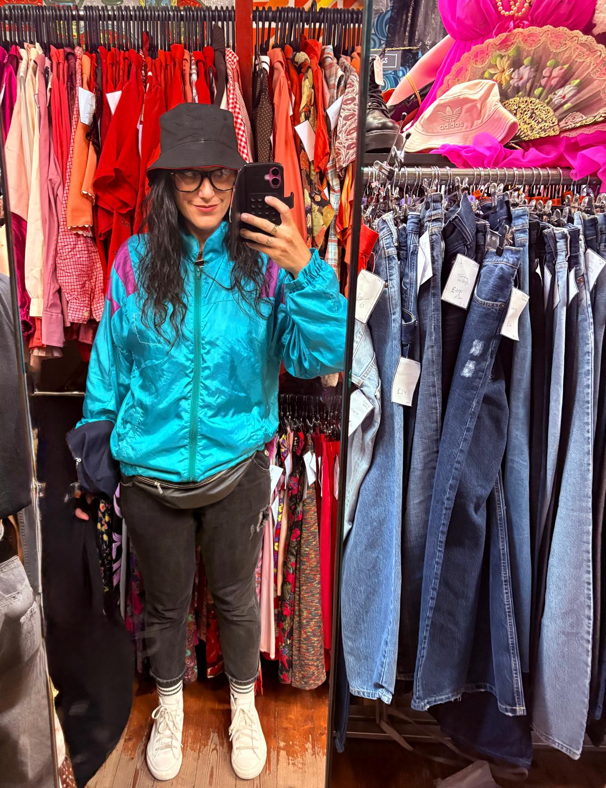 Victoria tries out a bucket hat and shiny shell suit