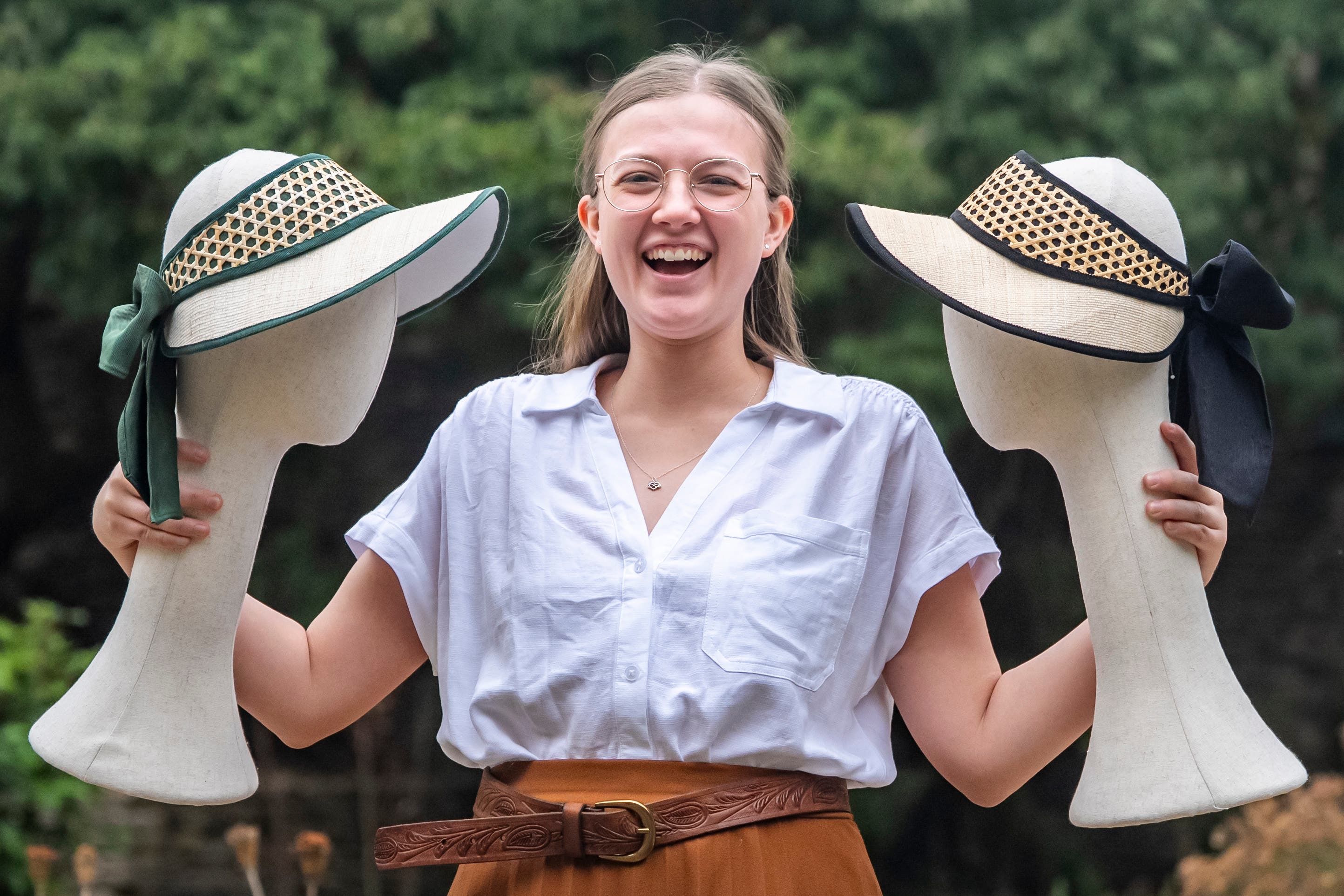 Milliner Emily Hurst with the Highgrove Visor (left) and another of her creations in Navy (Ben Birchall/PA)
