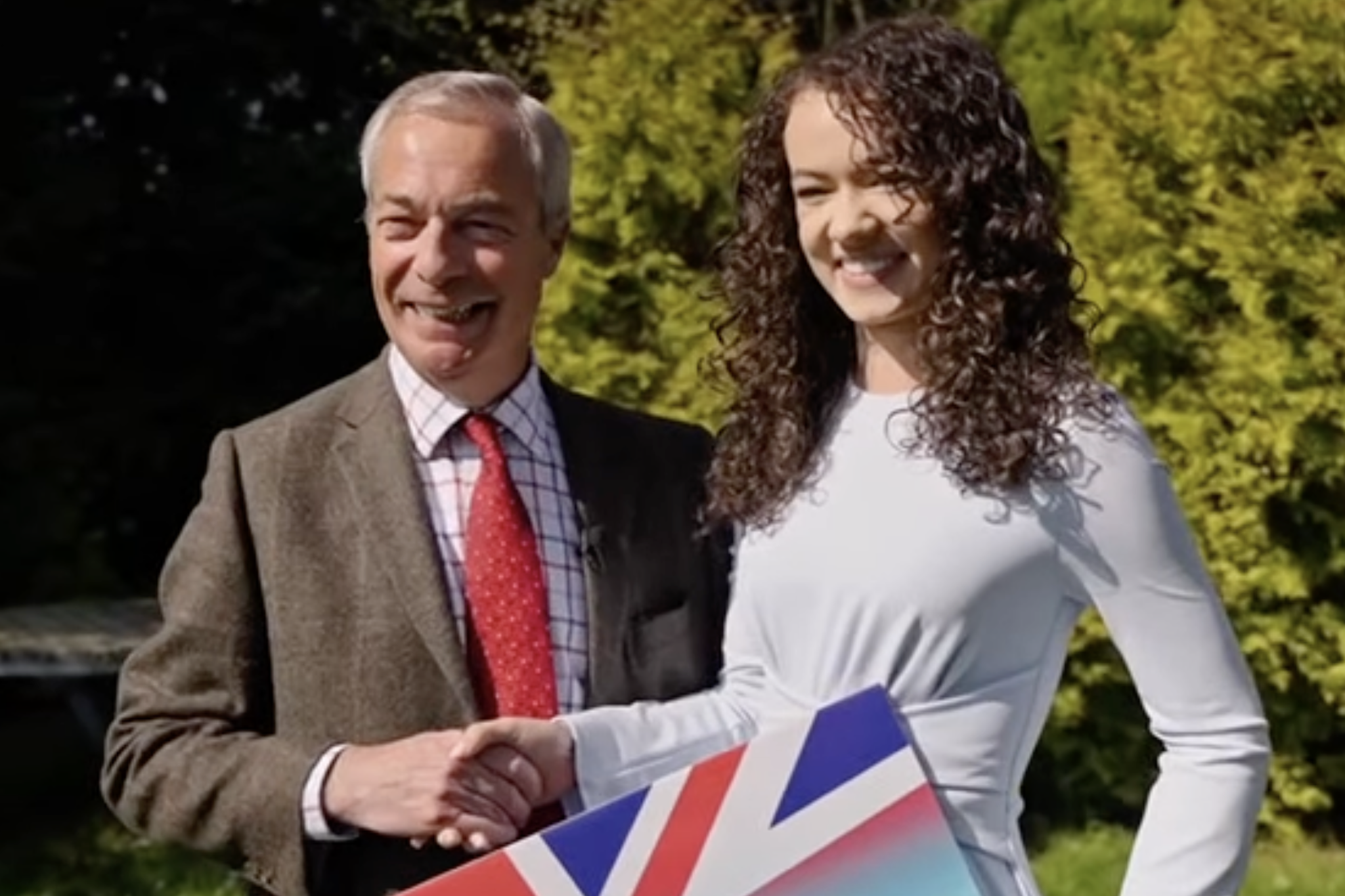 Farage pictured with Charlotte Hill, a 25-year-old Reform councillor