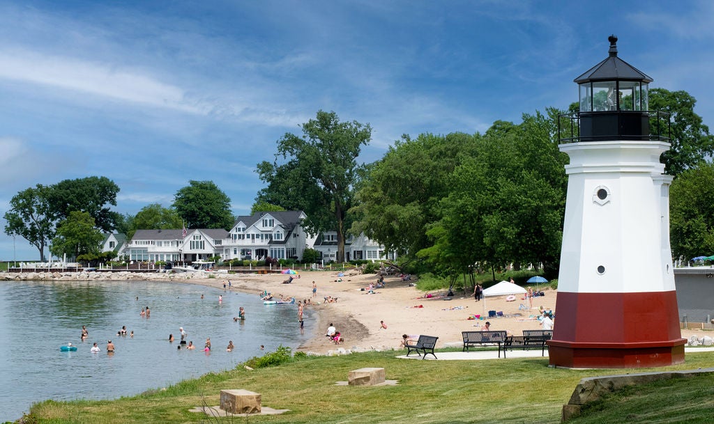 Perfectly formed Main Street Beach in Vermilion, Ohio, is flanked by beautiful white wooden properties and a lighthouse