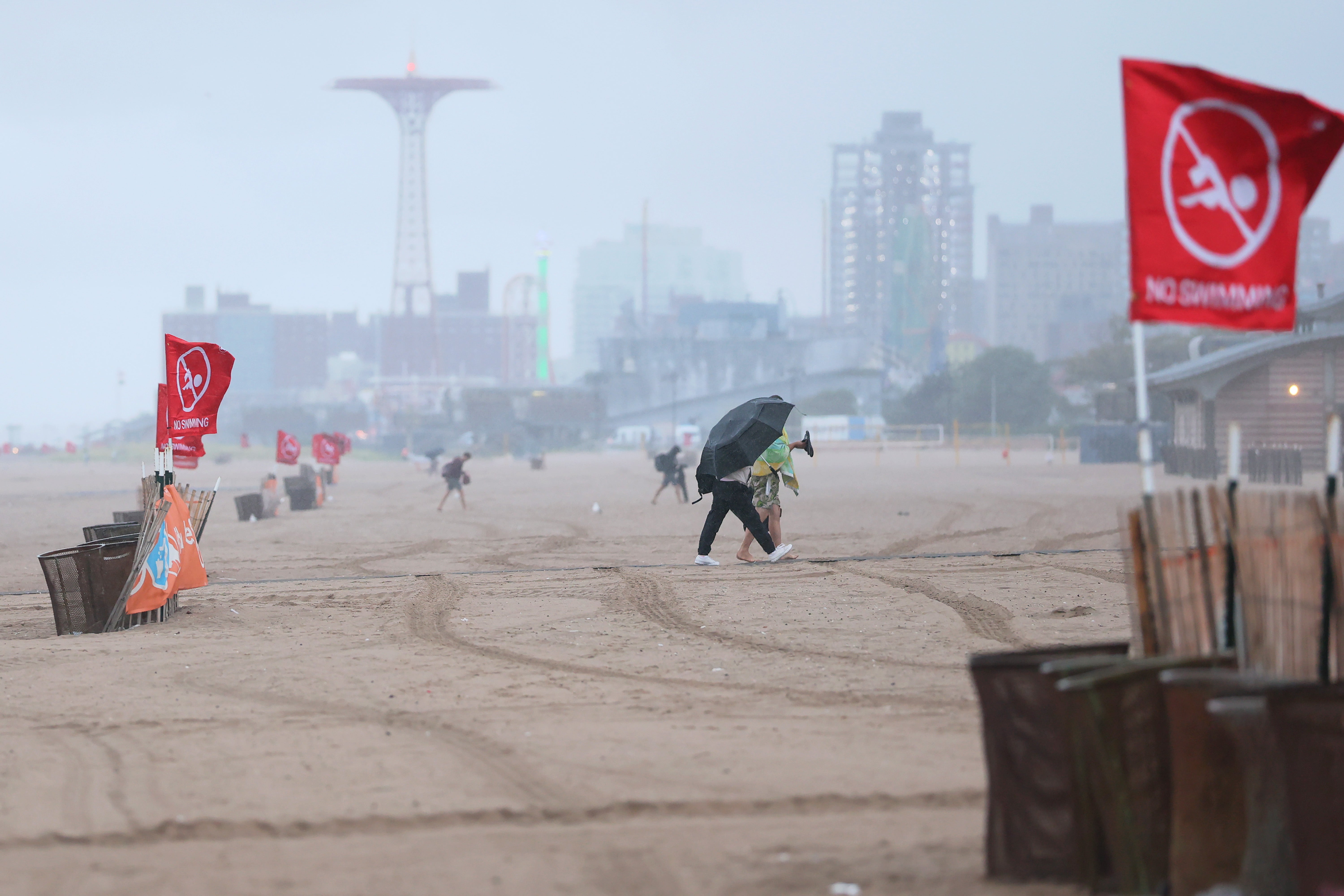 Red ‘No Swimming’ flags are seen in New York City as Hurricane Erin swiped the East Coast. Erin was the first hurricane of the Atlantic season and did not make landfall in the U.S.
