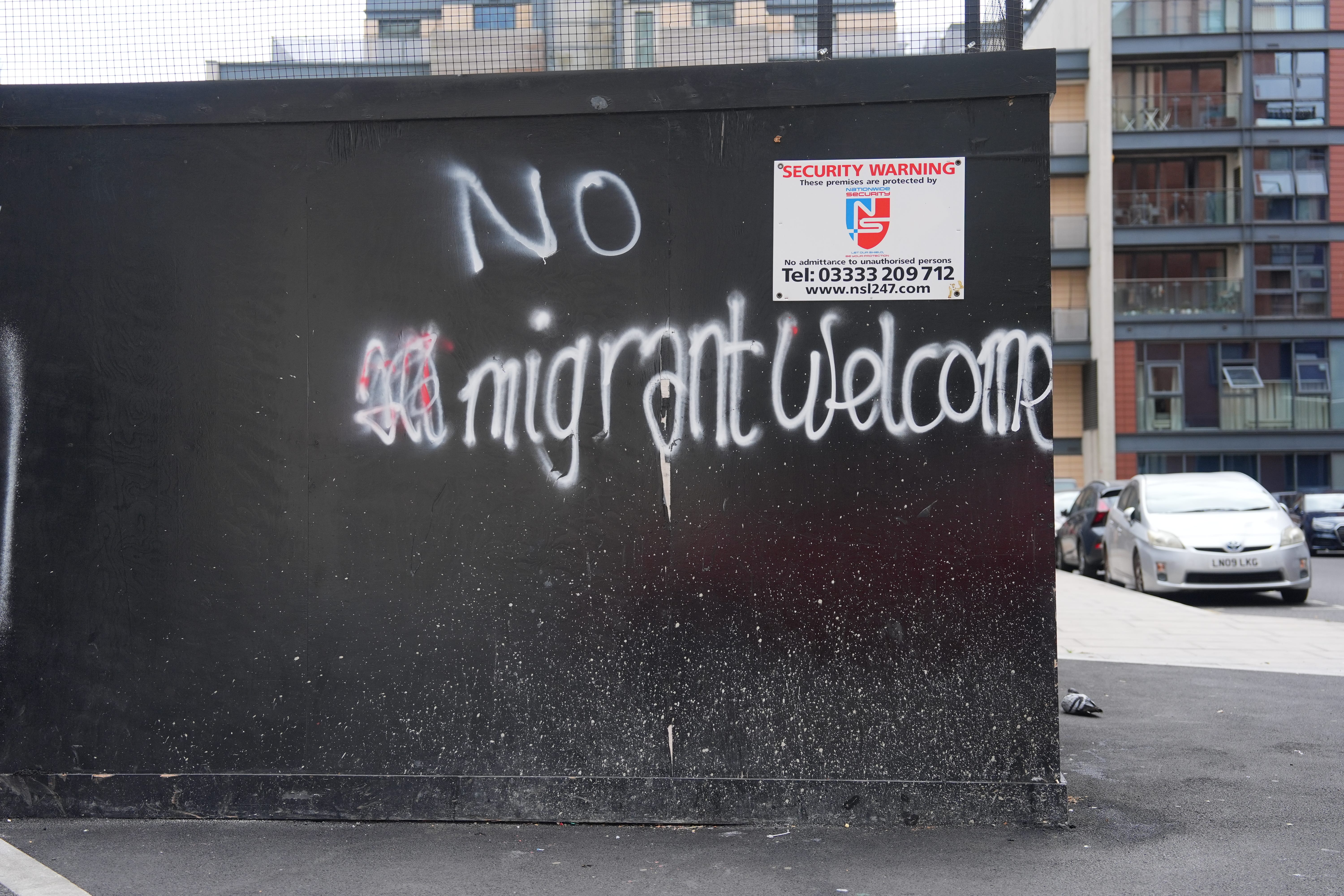 Graffiti near a hotel where asylum seekers are planned to be housed (Yui Mok/PA)