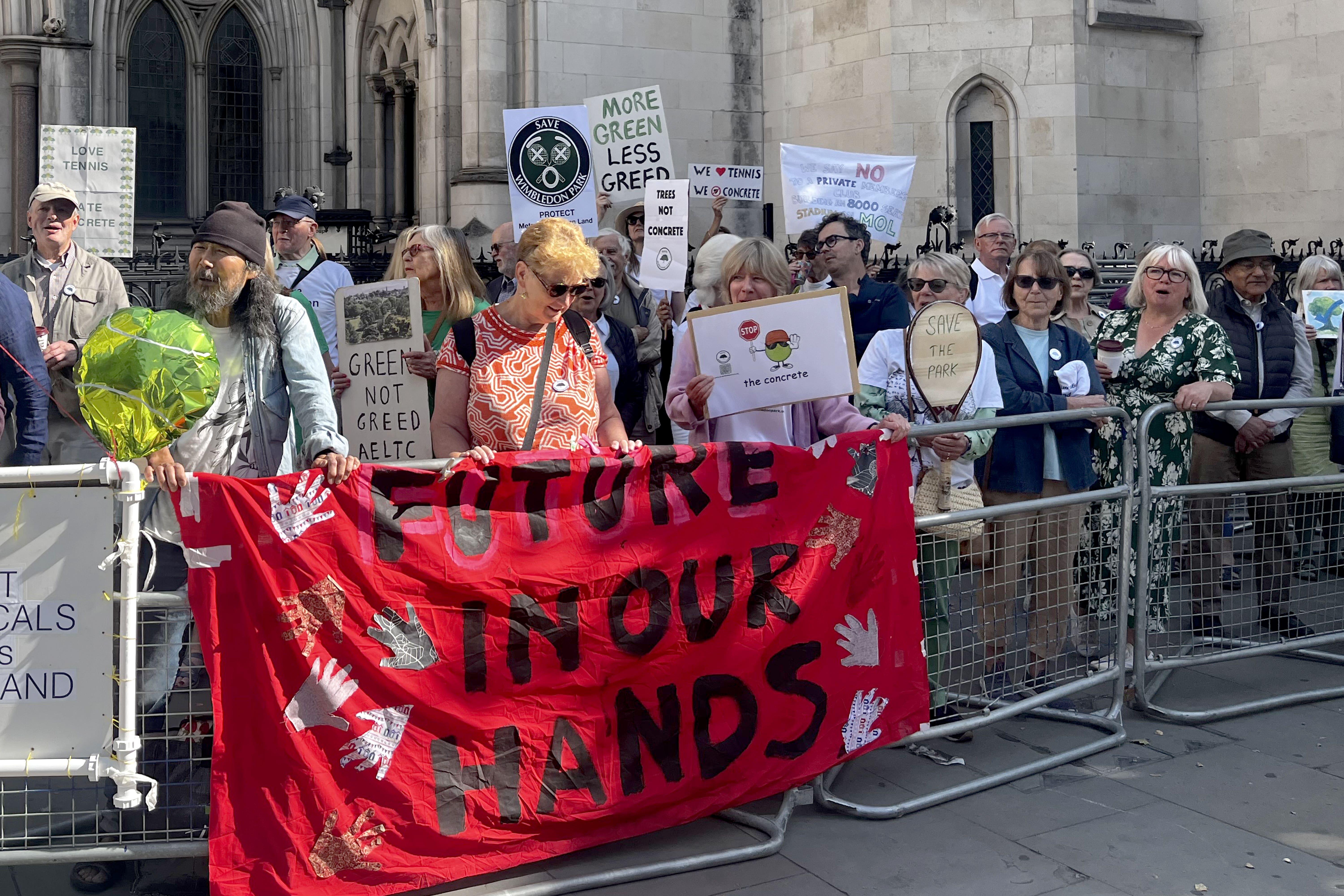 Protesters outside the Royal Courts of Justice (Callum Parke/PA)