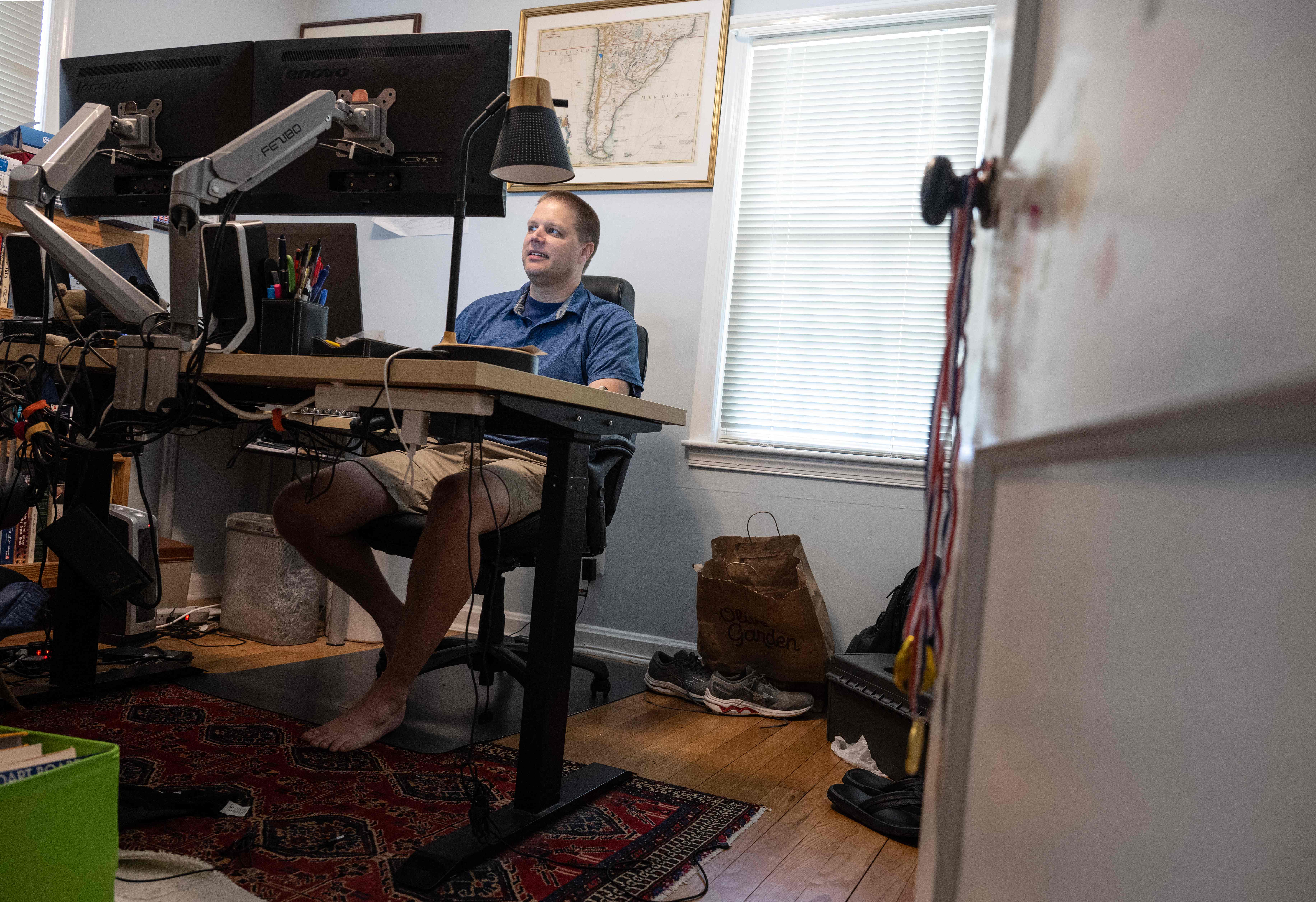 A man works from his home in Arlington, Virginia. Employers can help their employees consult them once a week