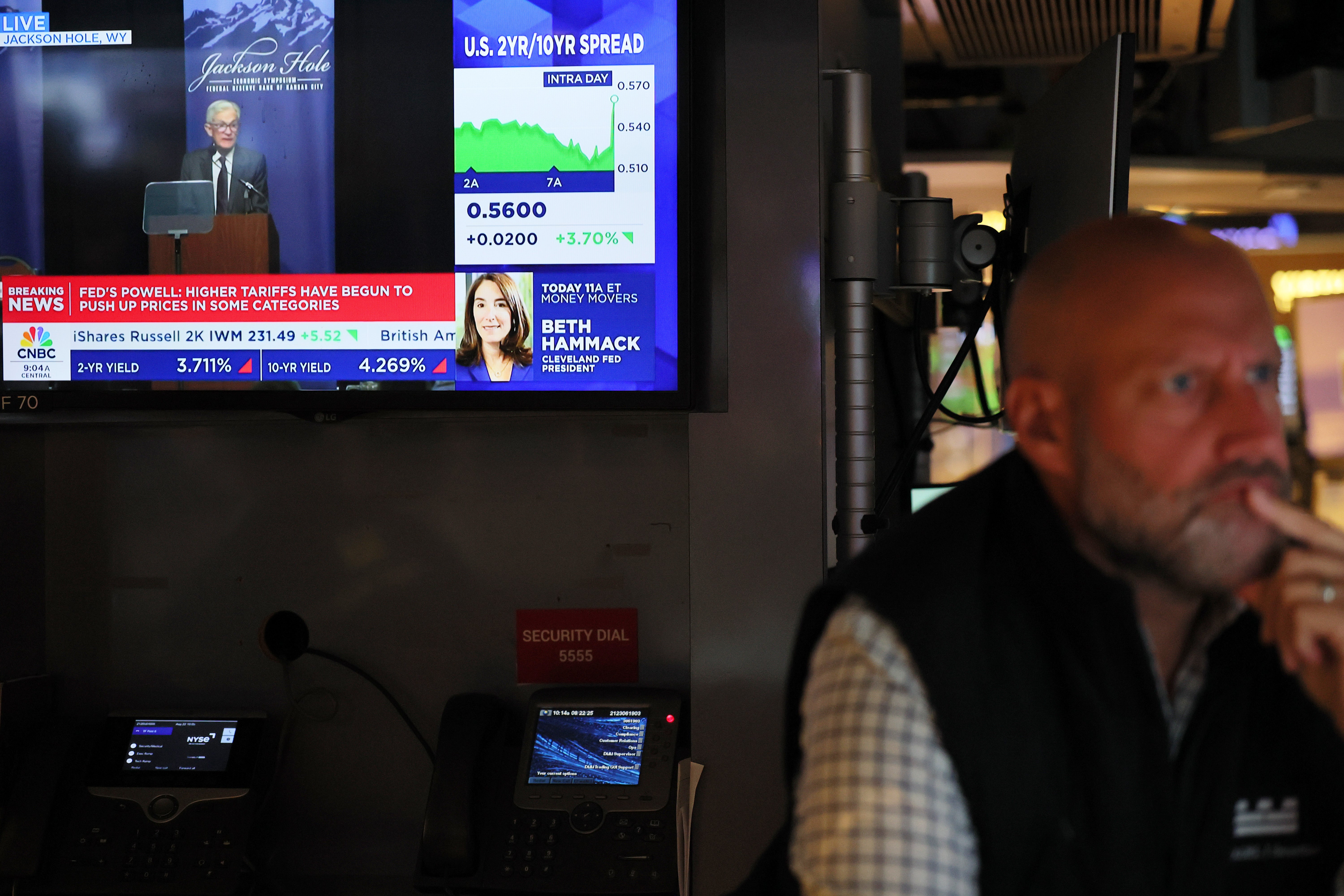Donald Trump gave a meandering answer when asked about a potential interest rate cut discussed by Fed Chair Jerome Powell earlier in the day. Pictured: A TV at the New York Stock Exchange shows Powell speaking about the potential rate cut.
