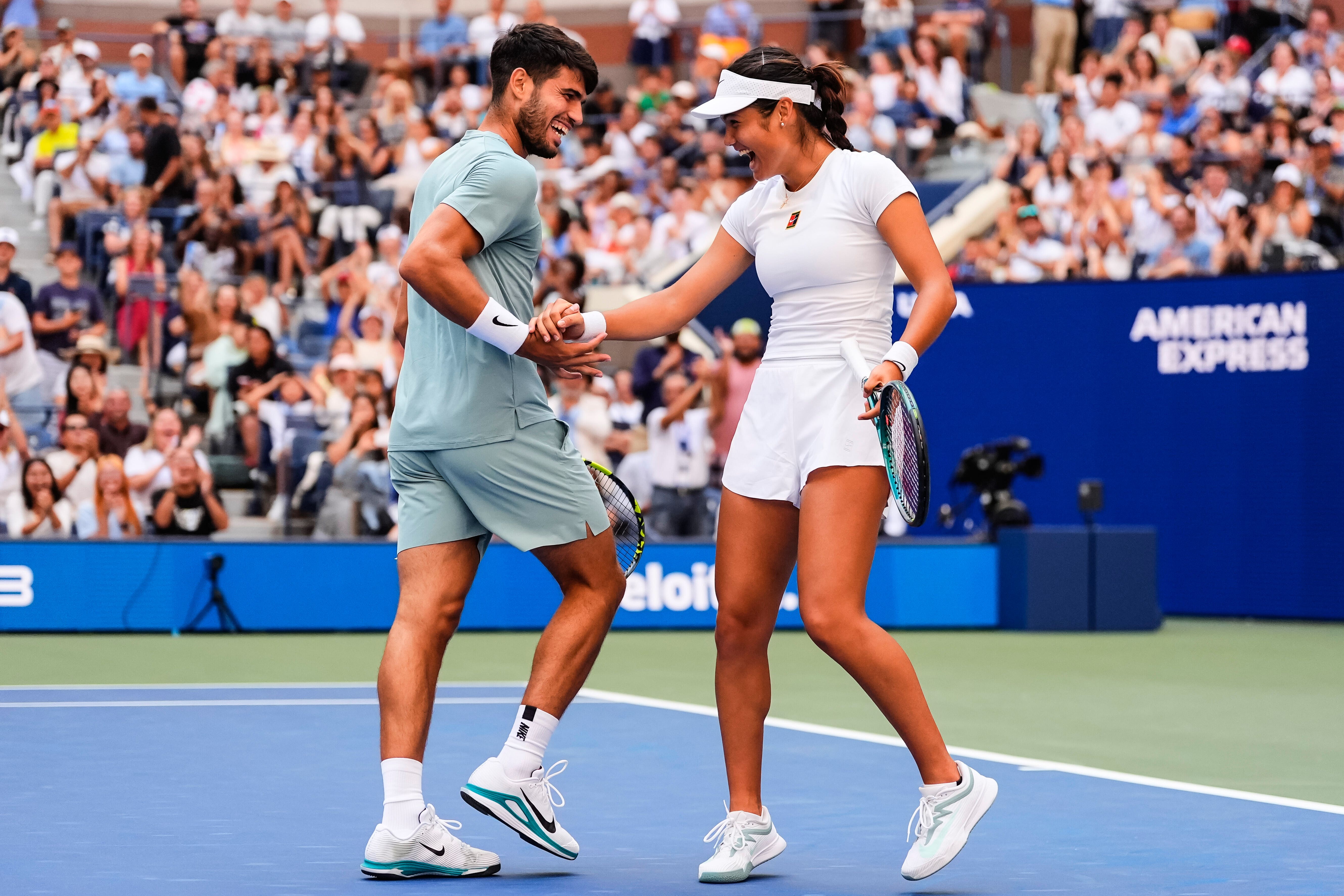 Emma Raducanu (right) and Carlos Alcaraz played mixed doubles together (Yuki Iwamura/AP)