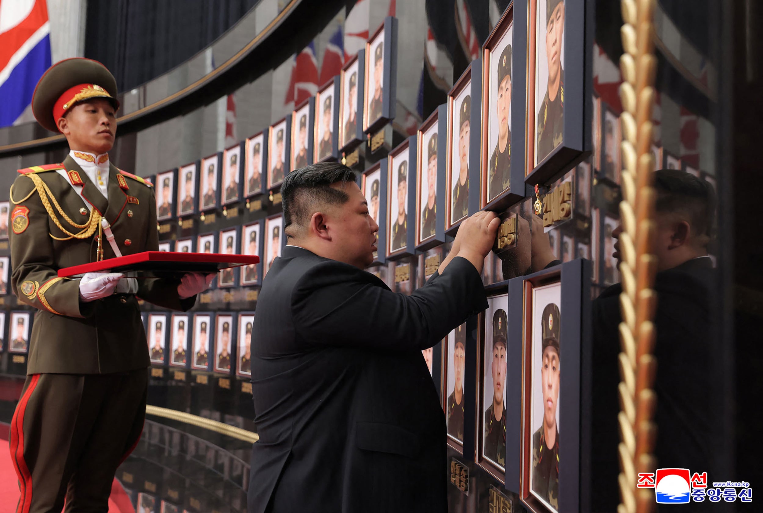 This undated picture released from North Korea's official Korean Central News Agency (KCNA) on August 22, 2025 shows North Korean leader Kim Jong Un visiting the memorial wall at a ceremony to award state commendations to the commander and combatants of the Korean People's Army's Overseas Operational Forces, who took part in military operations in Kursk Oblast of western Russia, at the headquarters building of the Central Committee of the The Workers' Party of Korea (WPK) in Pyongyang