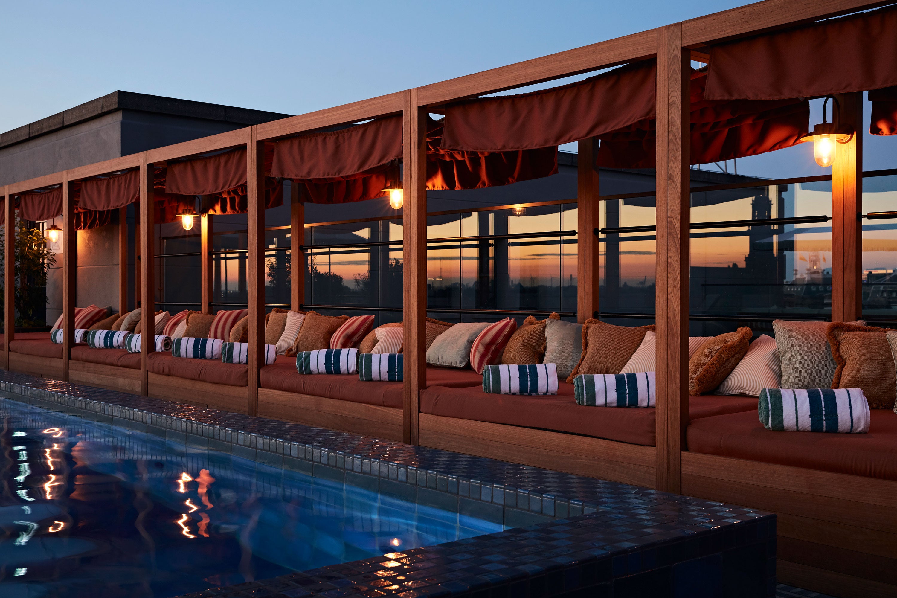 <p>The rooftop pools at the various outposts of Soho House (Soho House Amsterdam pictured) are often a highlight of a visit</p>