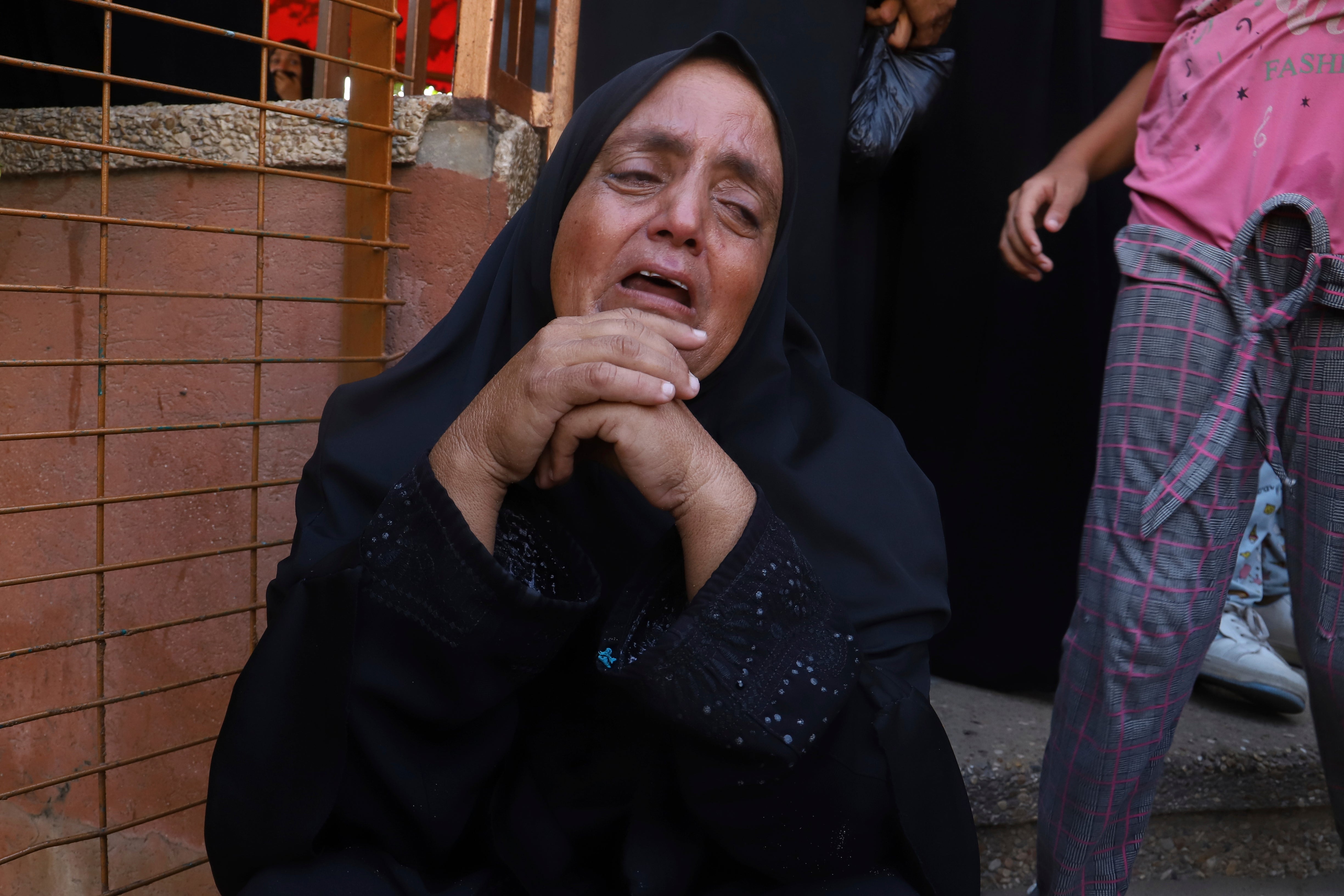 A Palestinian woman mourns her relative who was killed
