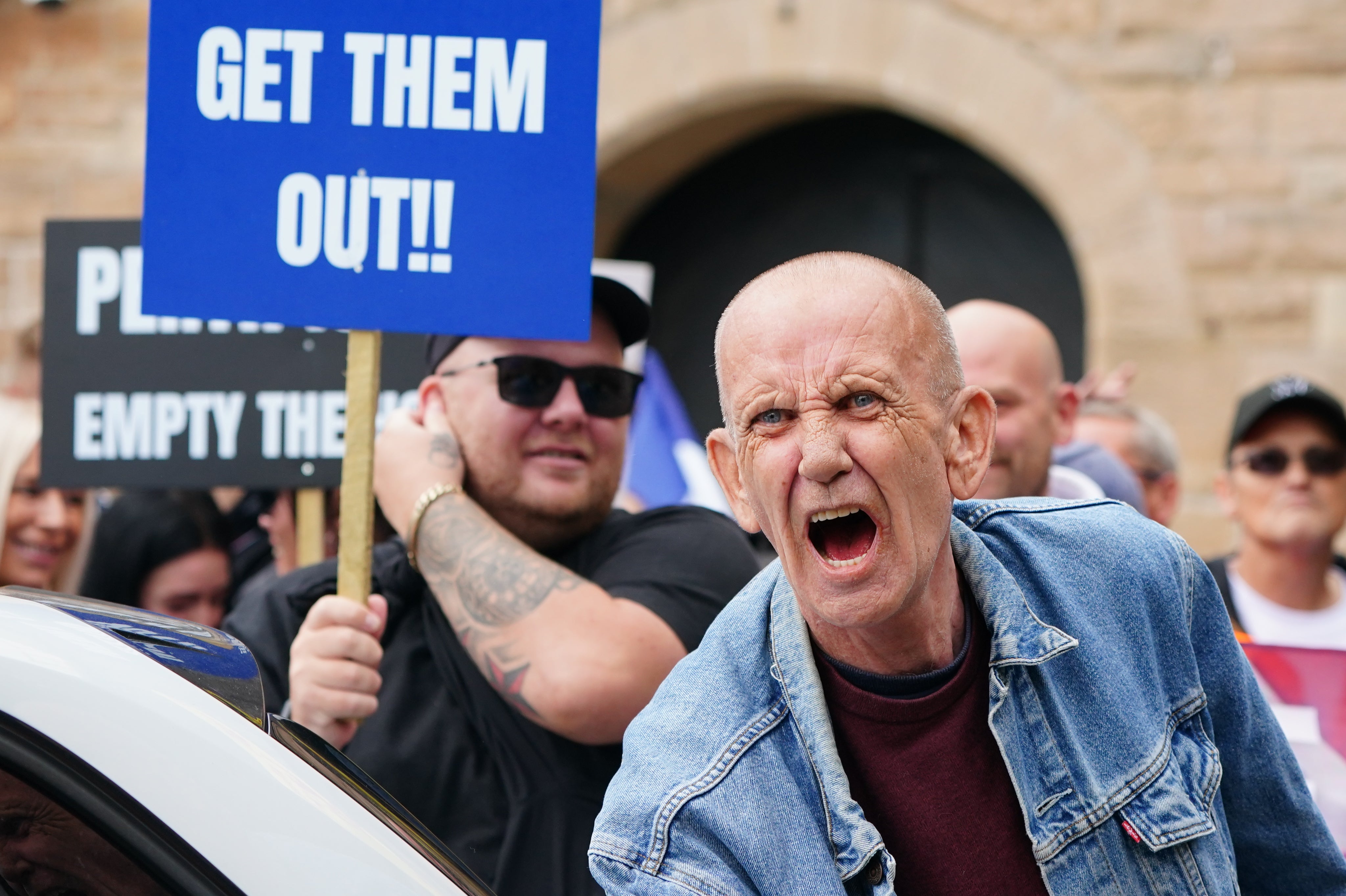 Demonstrators gathered outside asylum hotels on Saturday