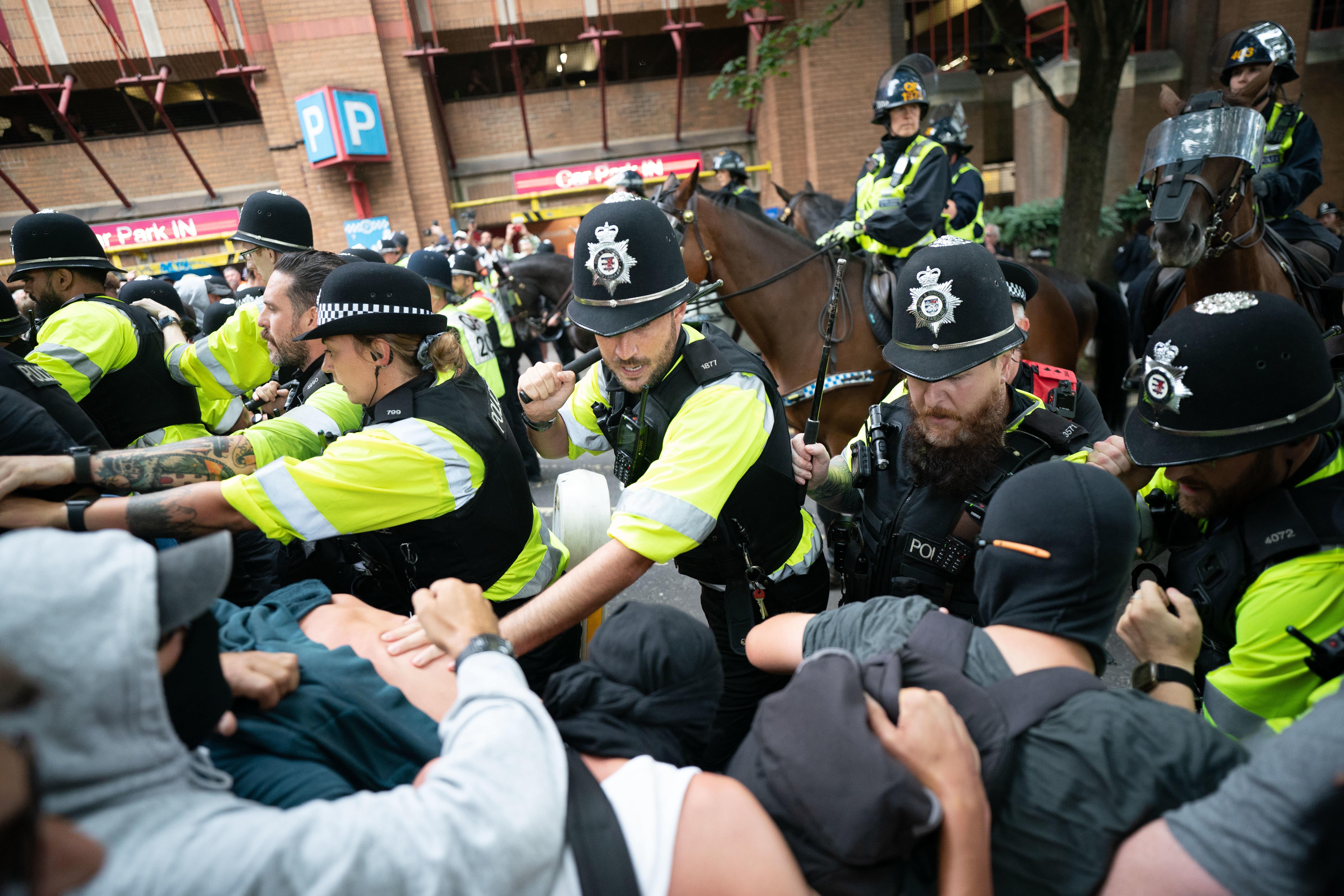 Police scuffle with demonstrators at Castle Park in Bristol (Ben Birchall/PA)