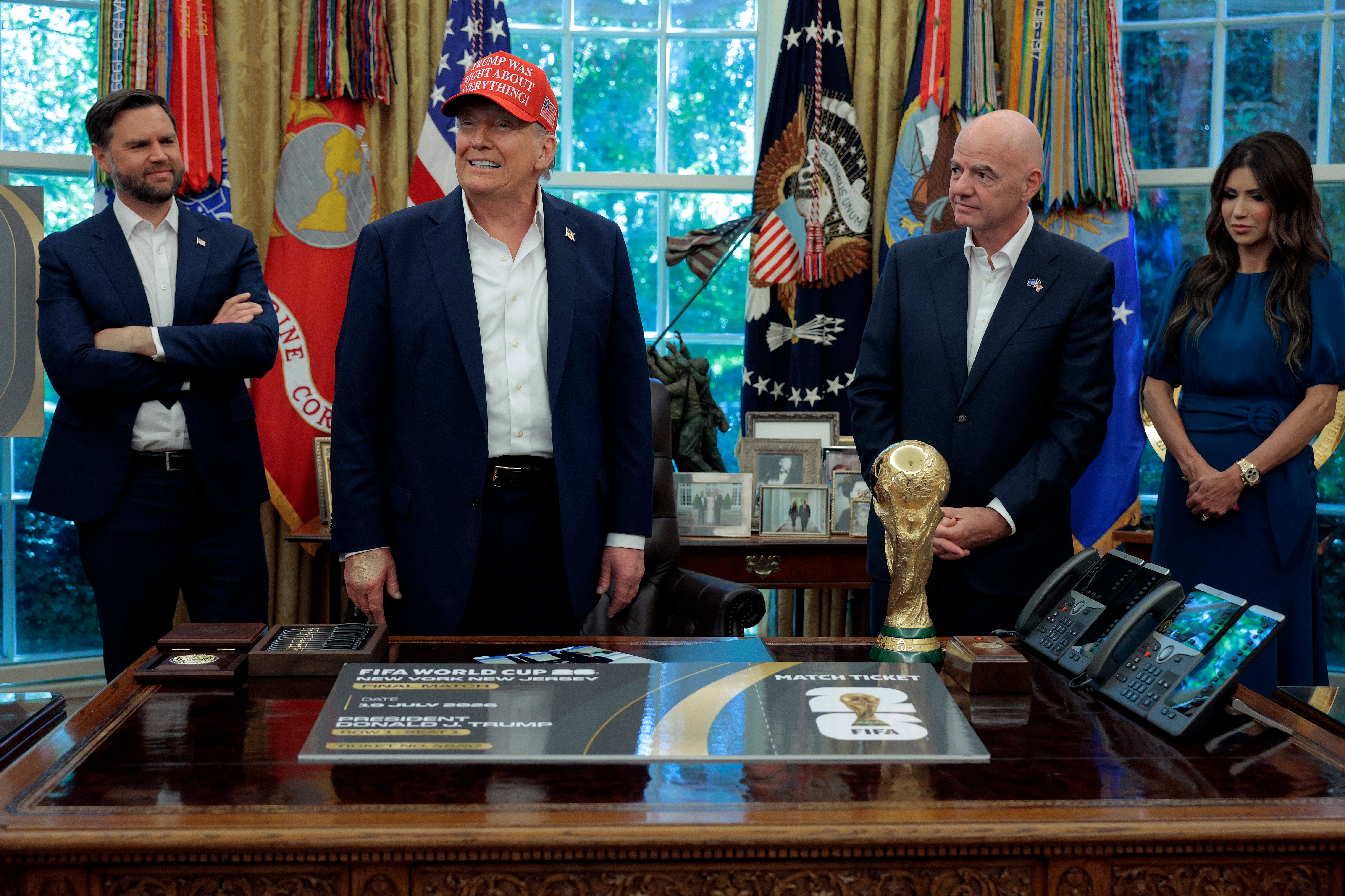 Trump's hand makeup was visible Friday in the Oval Office when he stood during his announcement that the FIFA World Cup 2026 draw will take place at The Kennedy Center