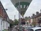 Moment hot air balloon lands on street in front of stunned residents