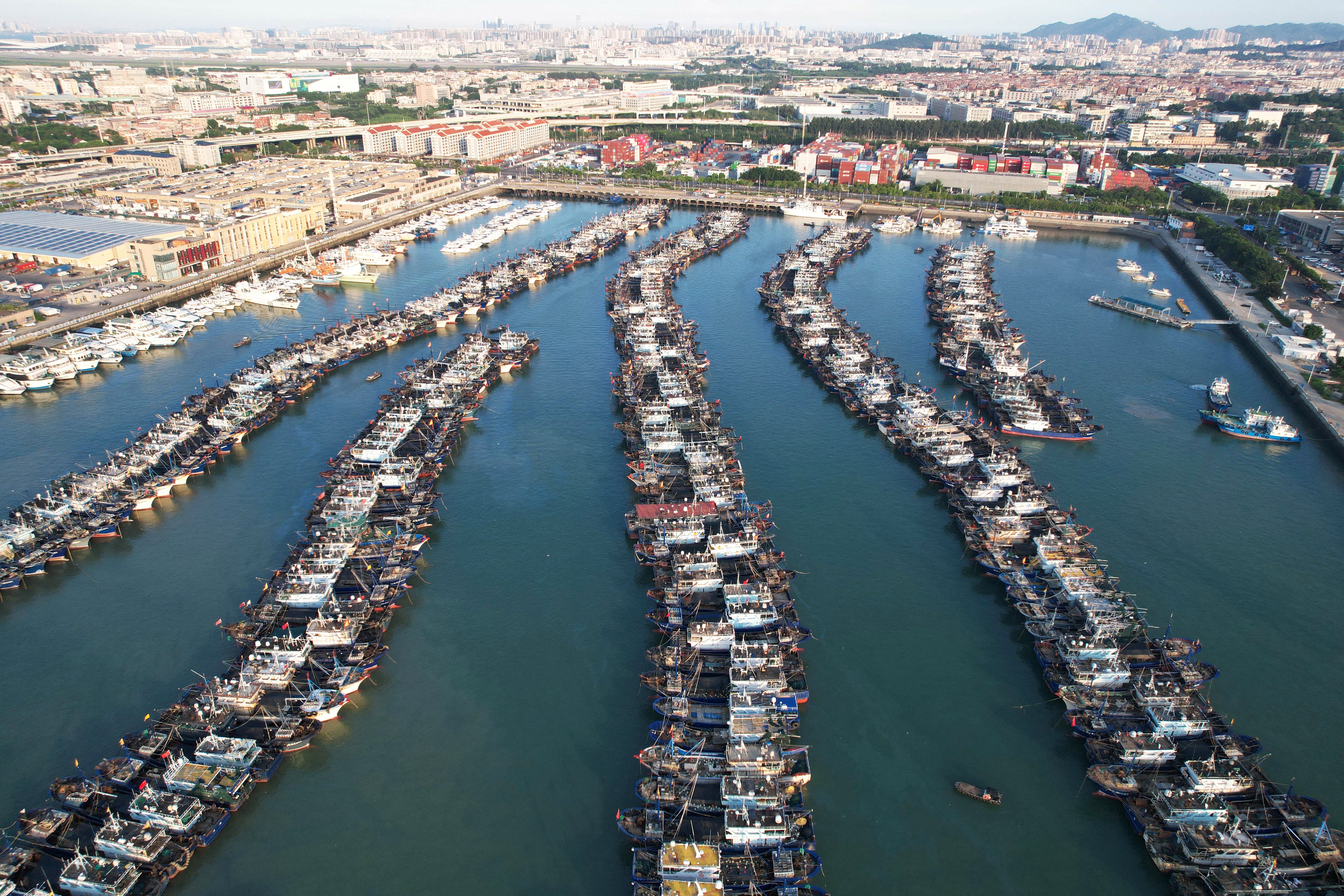 Aerial view of fishing boats moored in anticipation of Typhoon Podul in China on 12 August 2025
